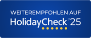 „Empfohlen auf HolidayCheck 25“. Blaues rechteckiges Badge mit weißem und goldenem Text/Punkten.