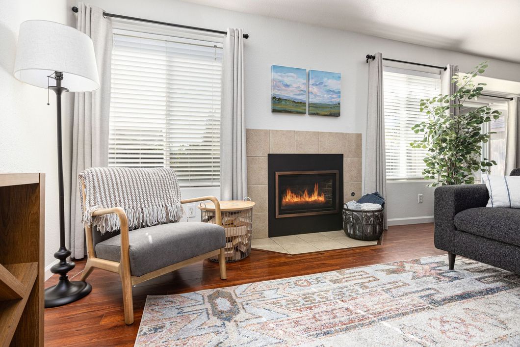 A living room with a fireplace. 