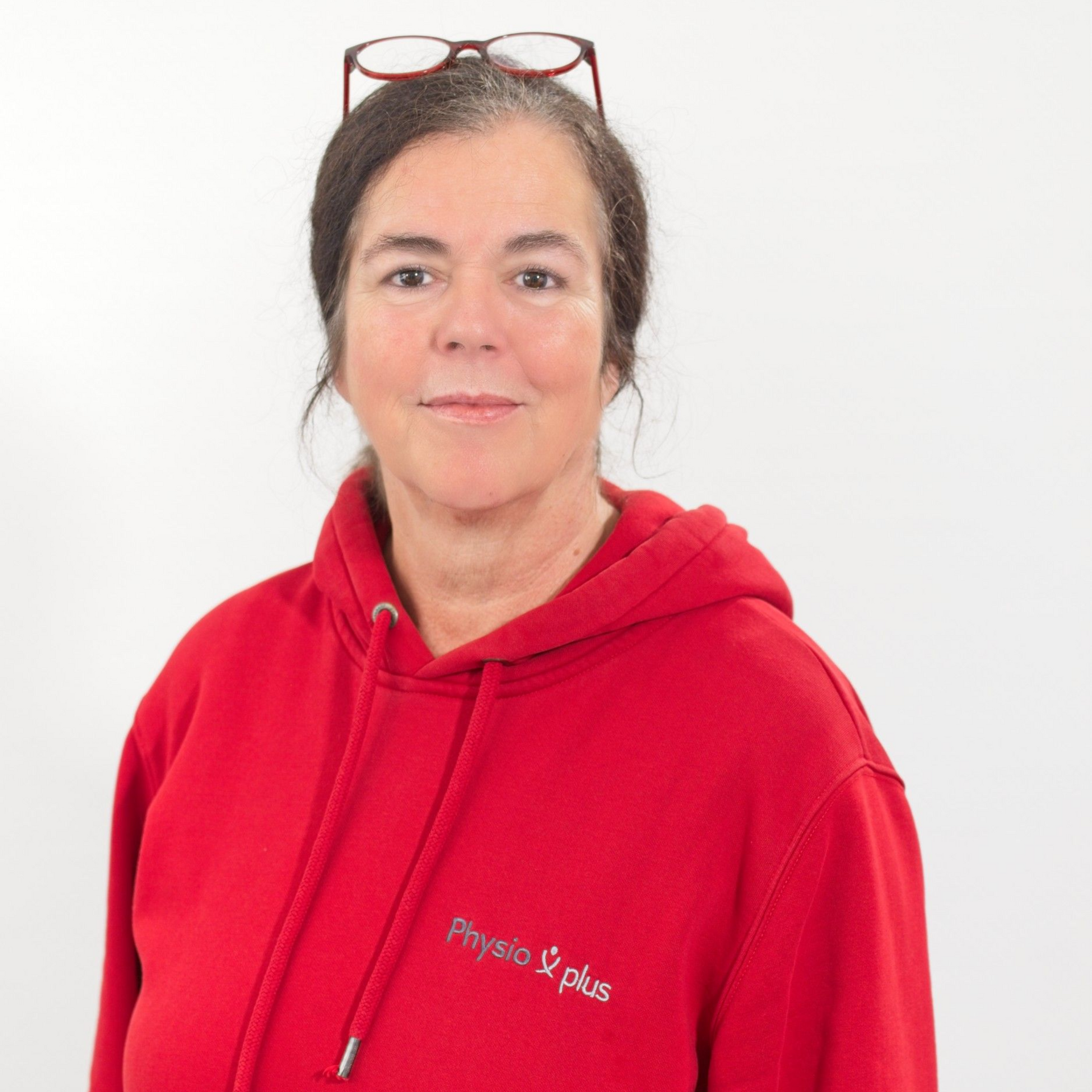 Eine Silhouette des Kopfes und Halses einer Frau auf einem weißen Hintergrund.