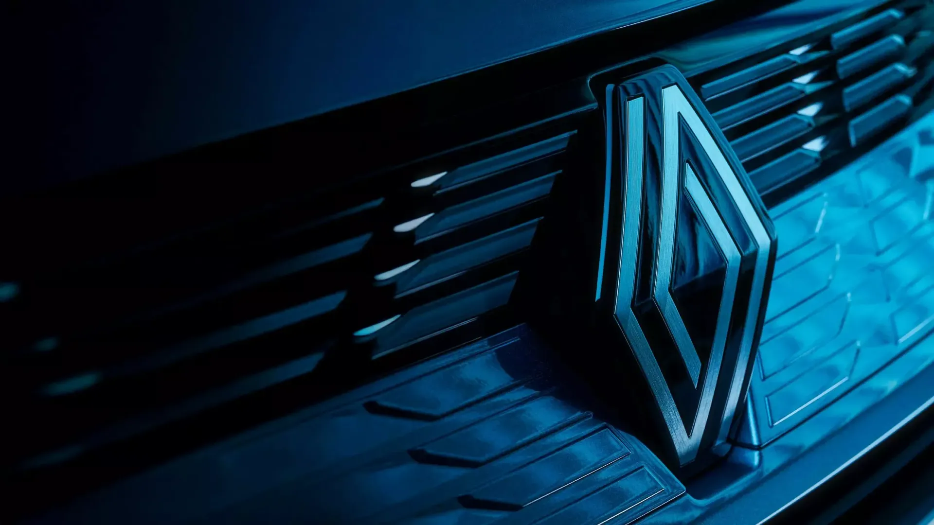 Logo Renault sur une calandre de voiture en bleu