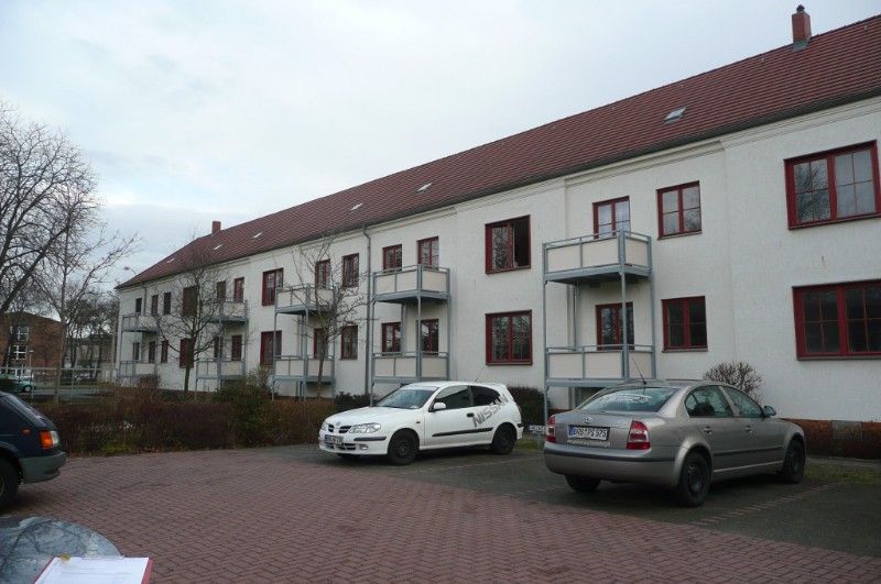 Sanierung Mehrfamilienhaus Reihe mit neuen Balkonen.