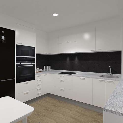 Una cocina con gabinetes blancos, electrodomésticos negros, un fregadero y una mesa.