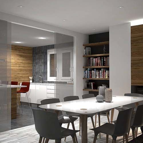 Un comedor con una mesa y sillas y una estantería.