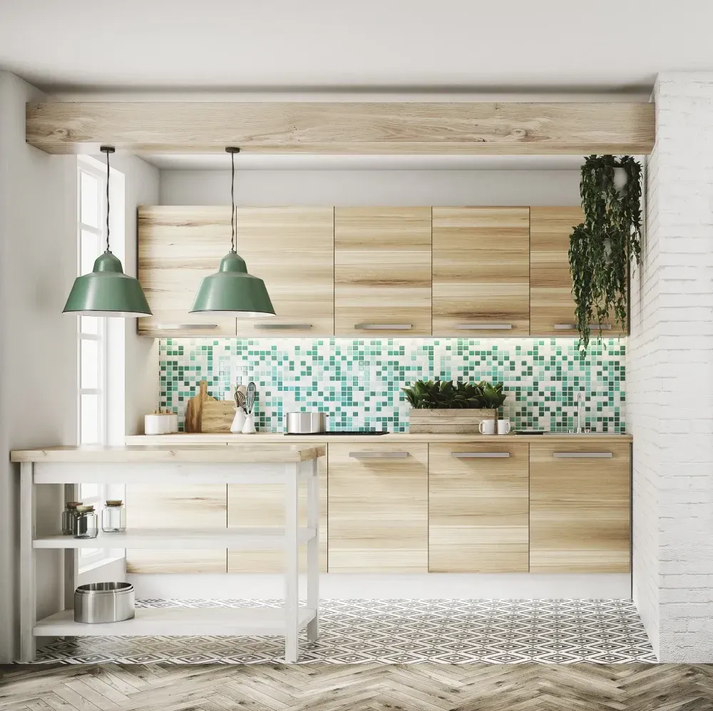 Una cocina con gabinetes de madera y luces colgantes verdes.