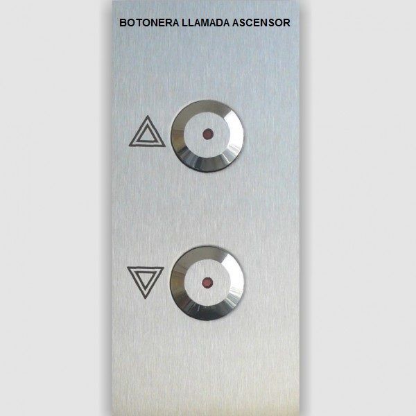Un botón de ascensor de acero inoxidable con un triángulo y un círculo.
