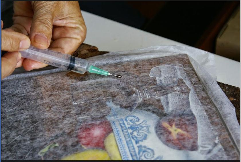 Refixage des zones soulevées