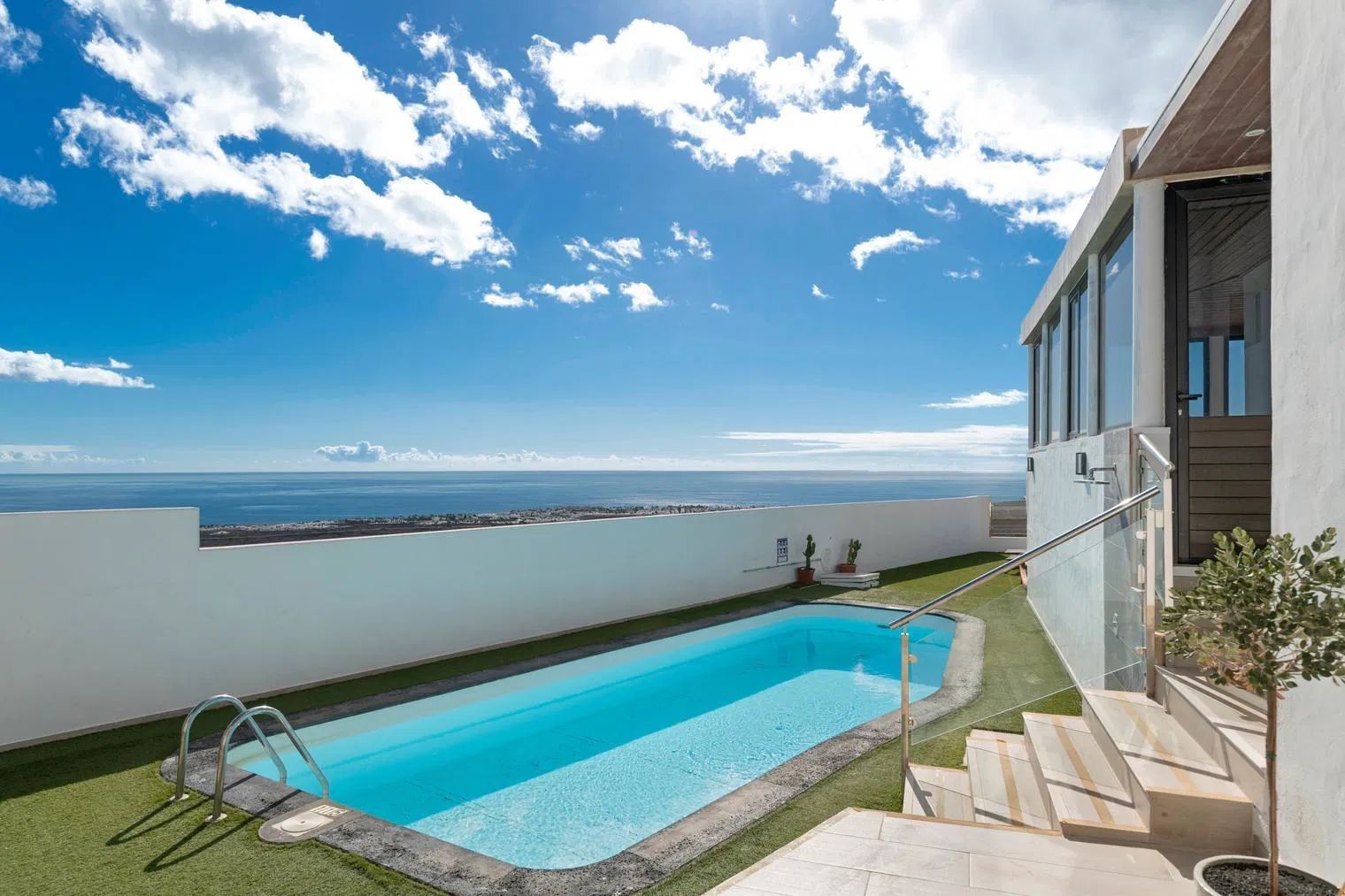 Outdoor private heated pool, villa near Puerto del Carmen, Lanzarote with sea and golf views