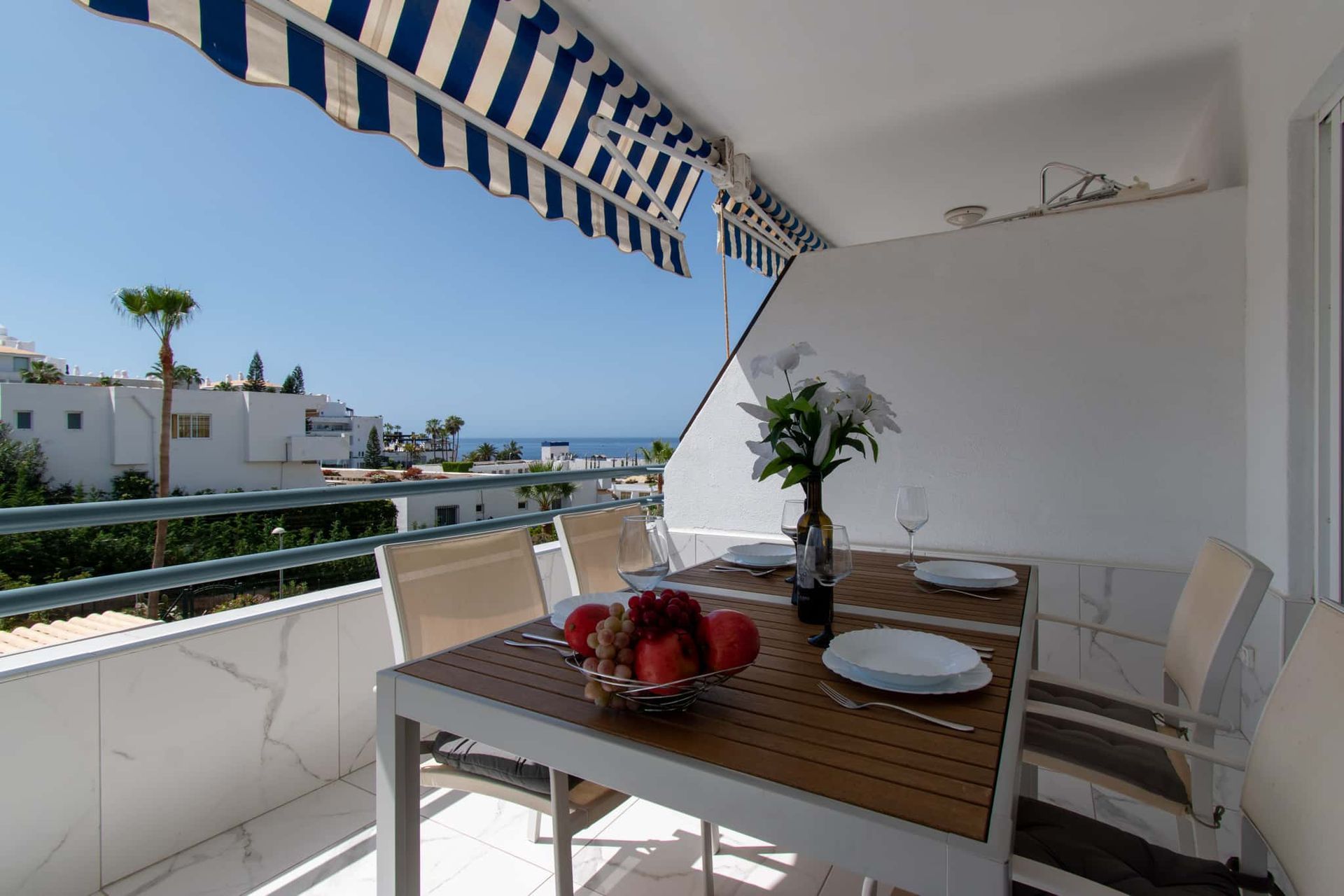 Balcony with sea view, patio table and chairs, sun awning, Club Atlantis, Costa Adeje, Tenerife.