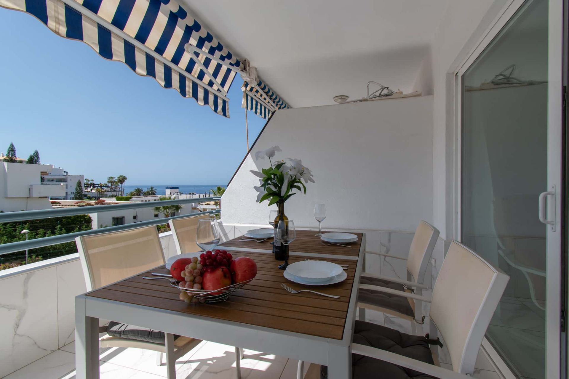 Balcony with patio table and chairs, sun awning sea view, Club Atlantis, Costa Adeje, Tenerife.
