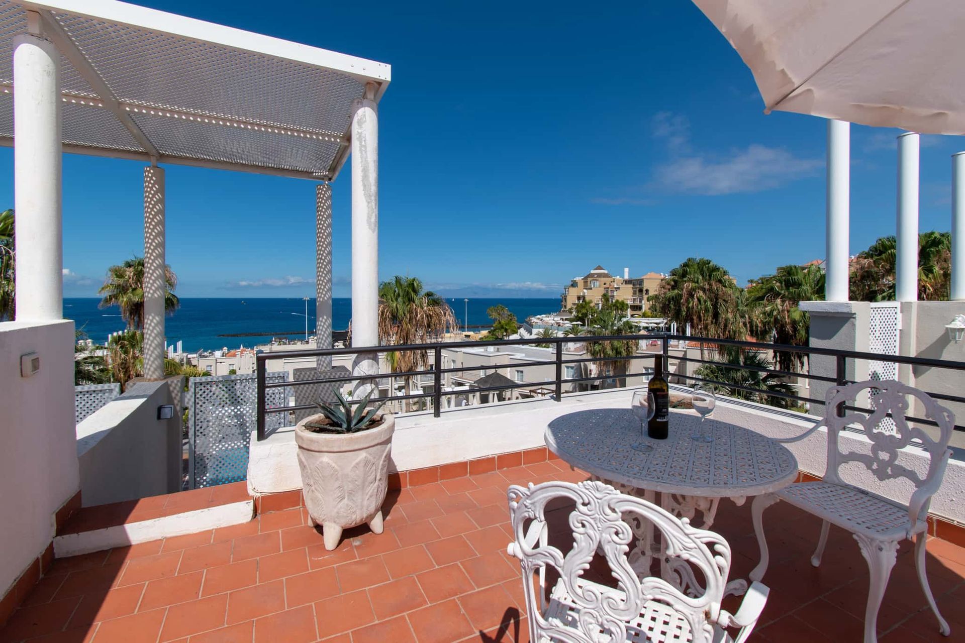 Roof terrace with patio table and chairs and sea view on Los Olivos, Costa Adeje, Tenerife.