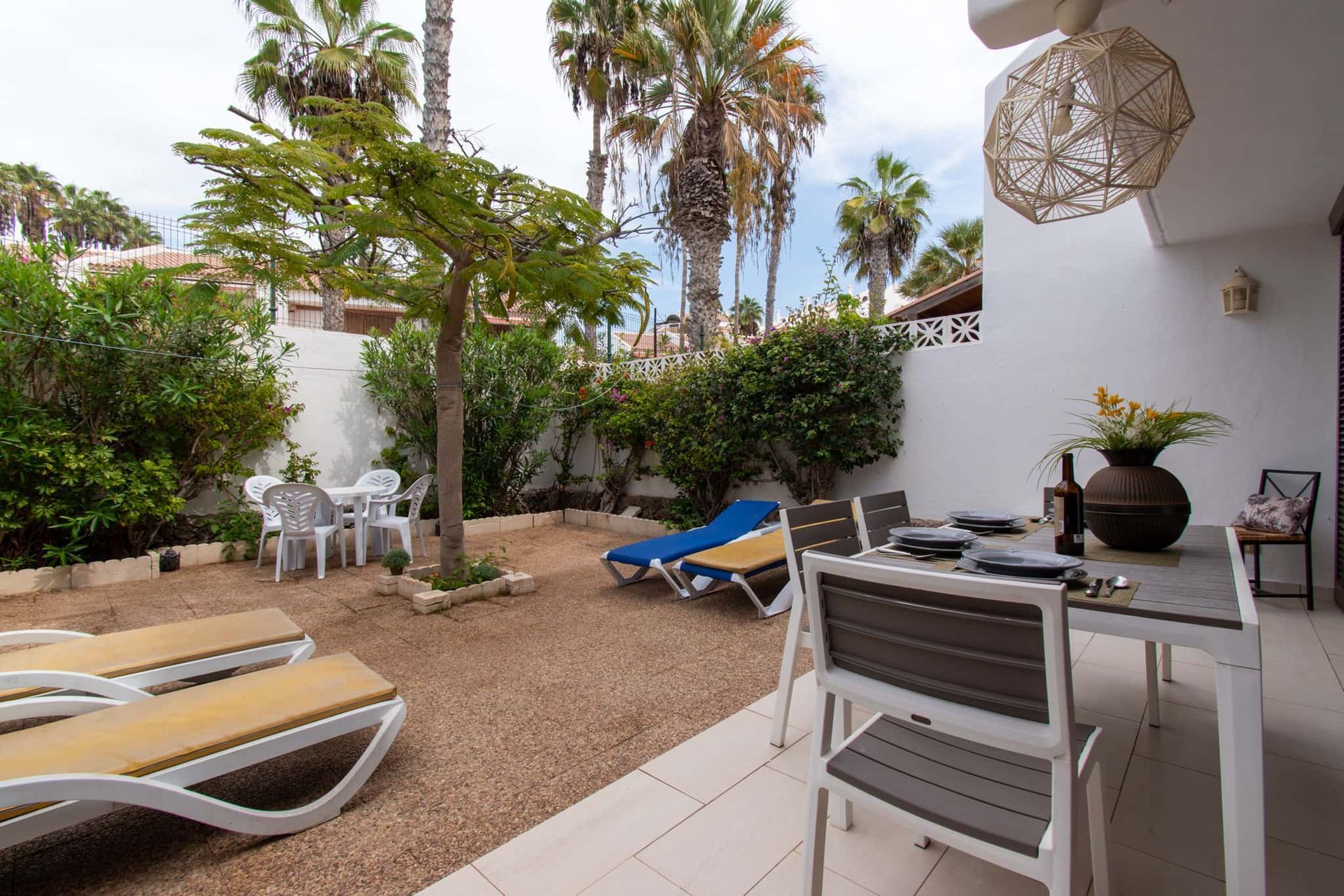 Terrace with patio table and chairs, sun loungers, Parque Santiago I, Playa de las Americas, Tenerife