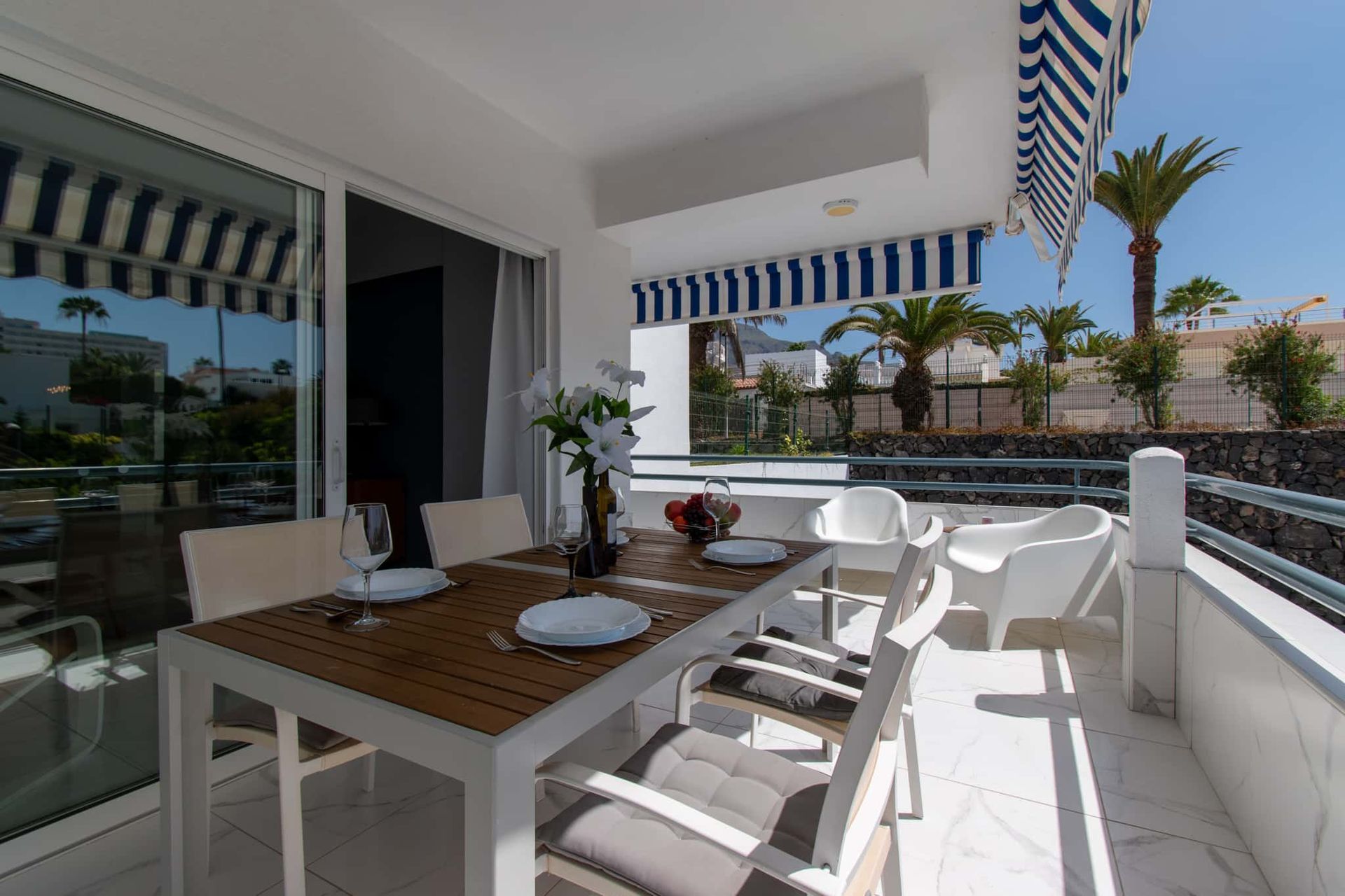 Balcony with patio table and chairs, sun awning, Club Atlantis, Costa Adeje, Tenerife.