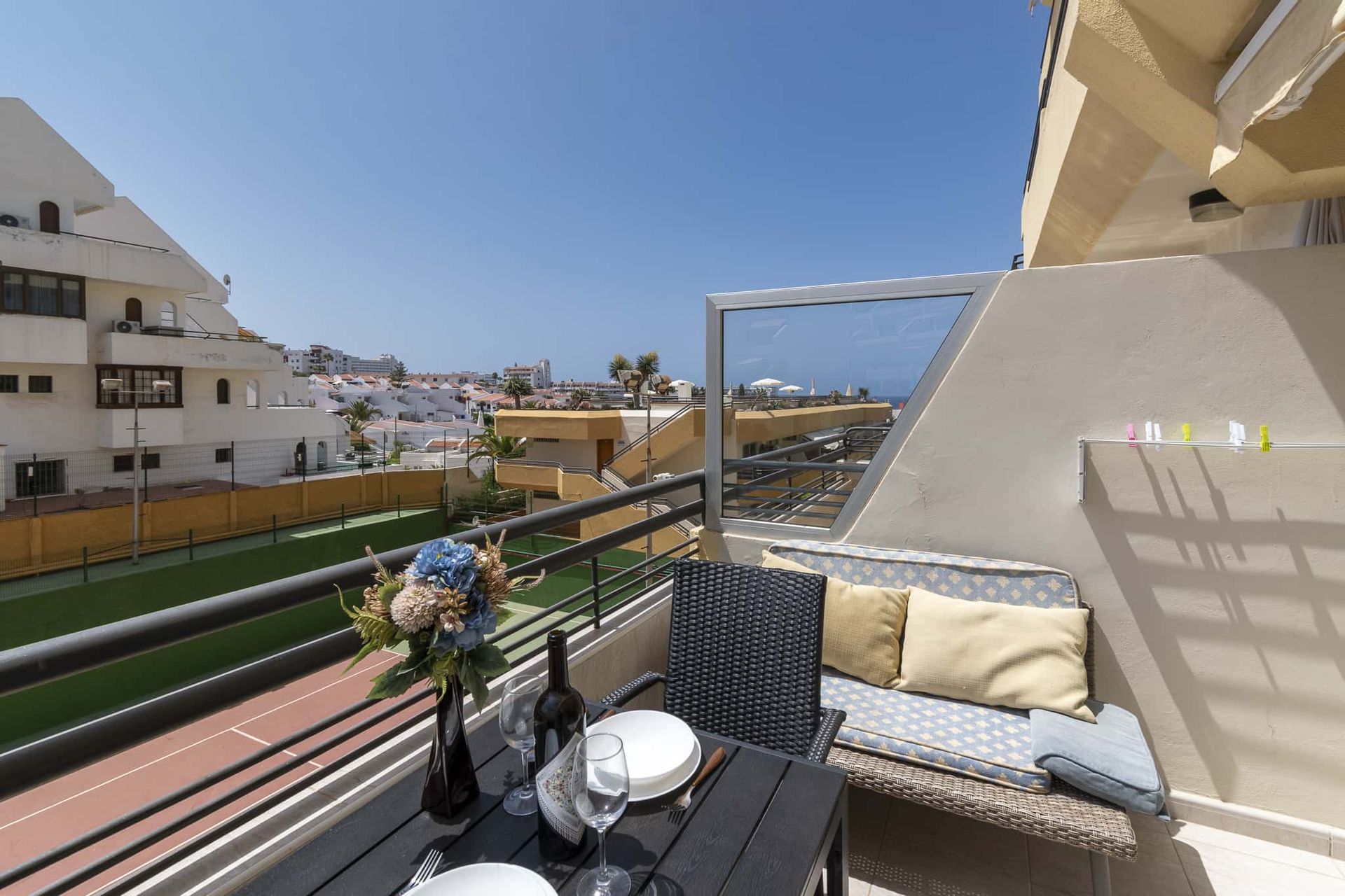 Balcony with patio table and chairs, sofa, tennis court view, Santa Maria, Costa Adeje, Tenerife
