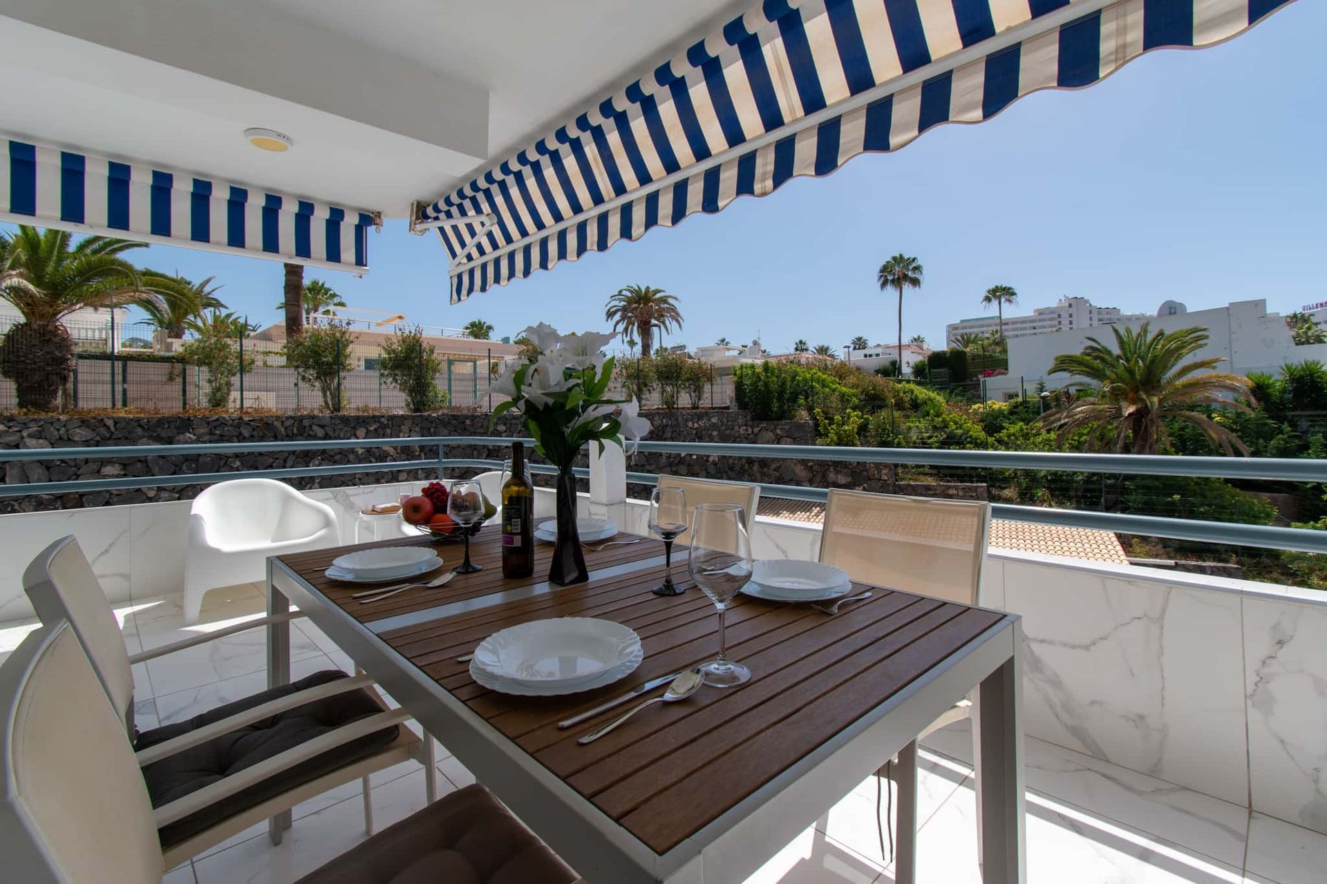 Balcony with patio table and chairs, sun awning, Club Atlantis, Costa Adeje, Tenerife.