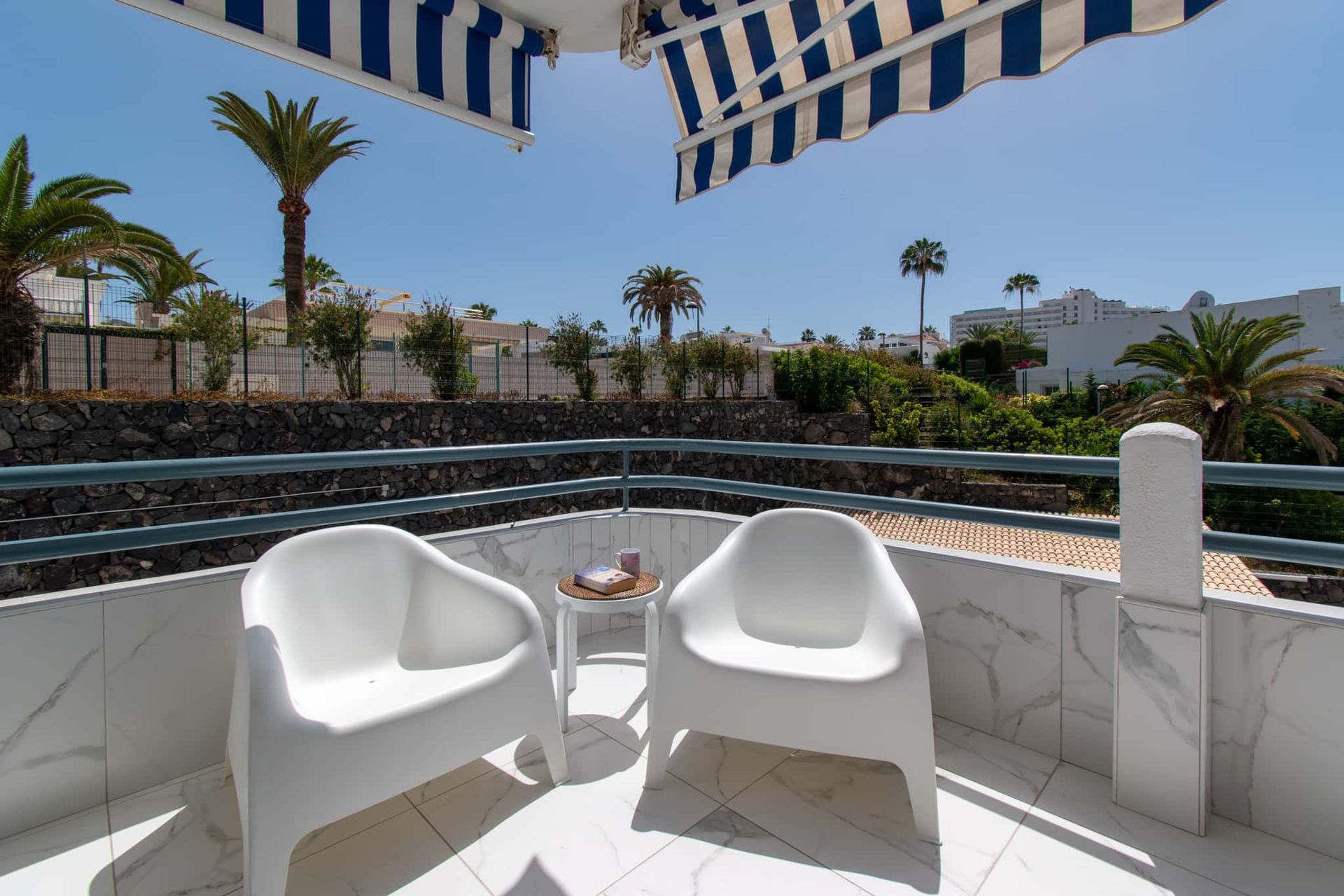 Balcony with 2 patio chairs and small table, sun awning, Club Atlantis, Costa Adeje, Tenerife.