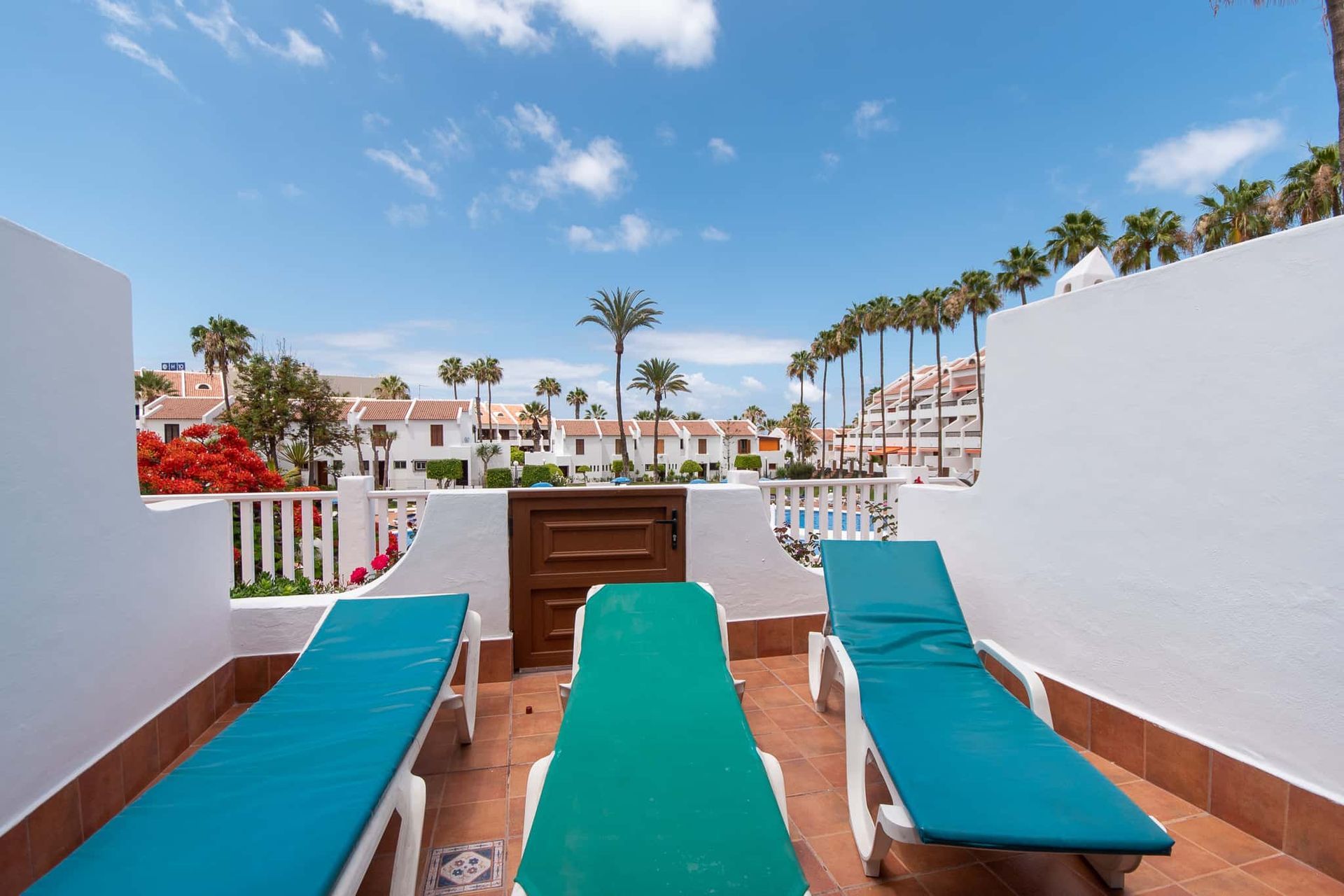 Terrace with sun loungers at Parque Santiago II, Playa de las Americas, Tenerife