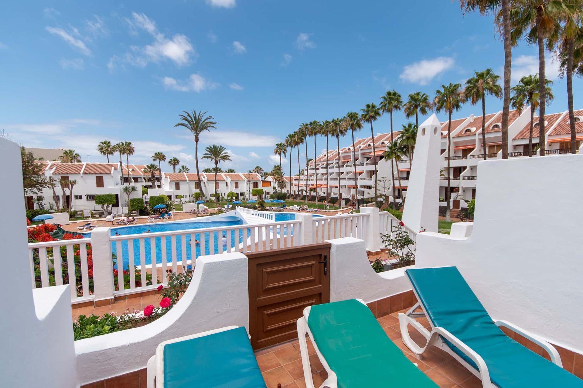 Terrace with sun loungers, pool view at Parque Santiago II, Playa de las Americas, Tenerife