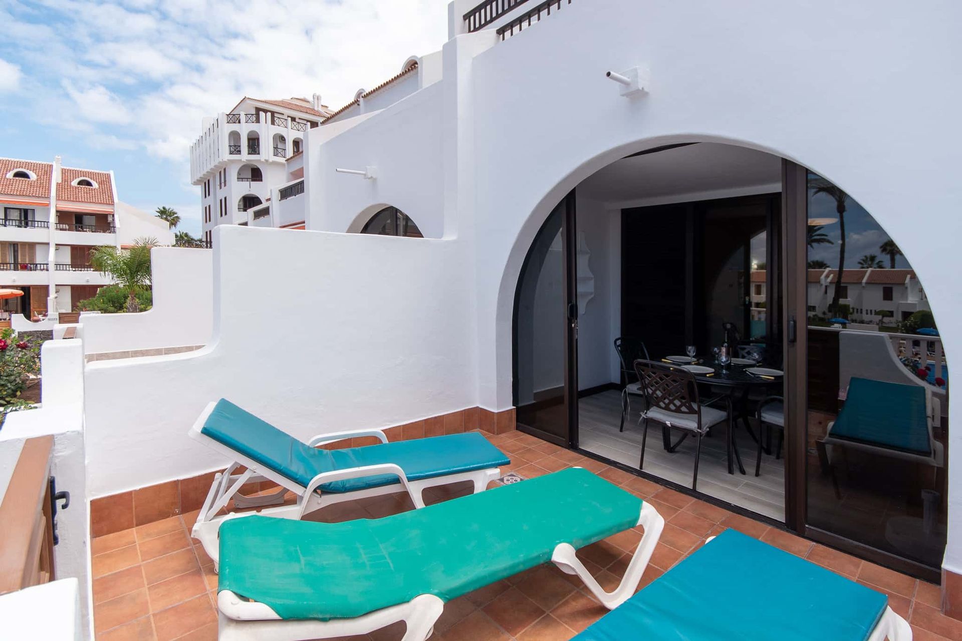 Terrace with sun loungers at Parque Santiago II, Playa de las Americas, Tenerife