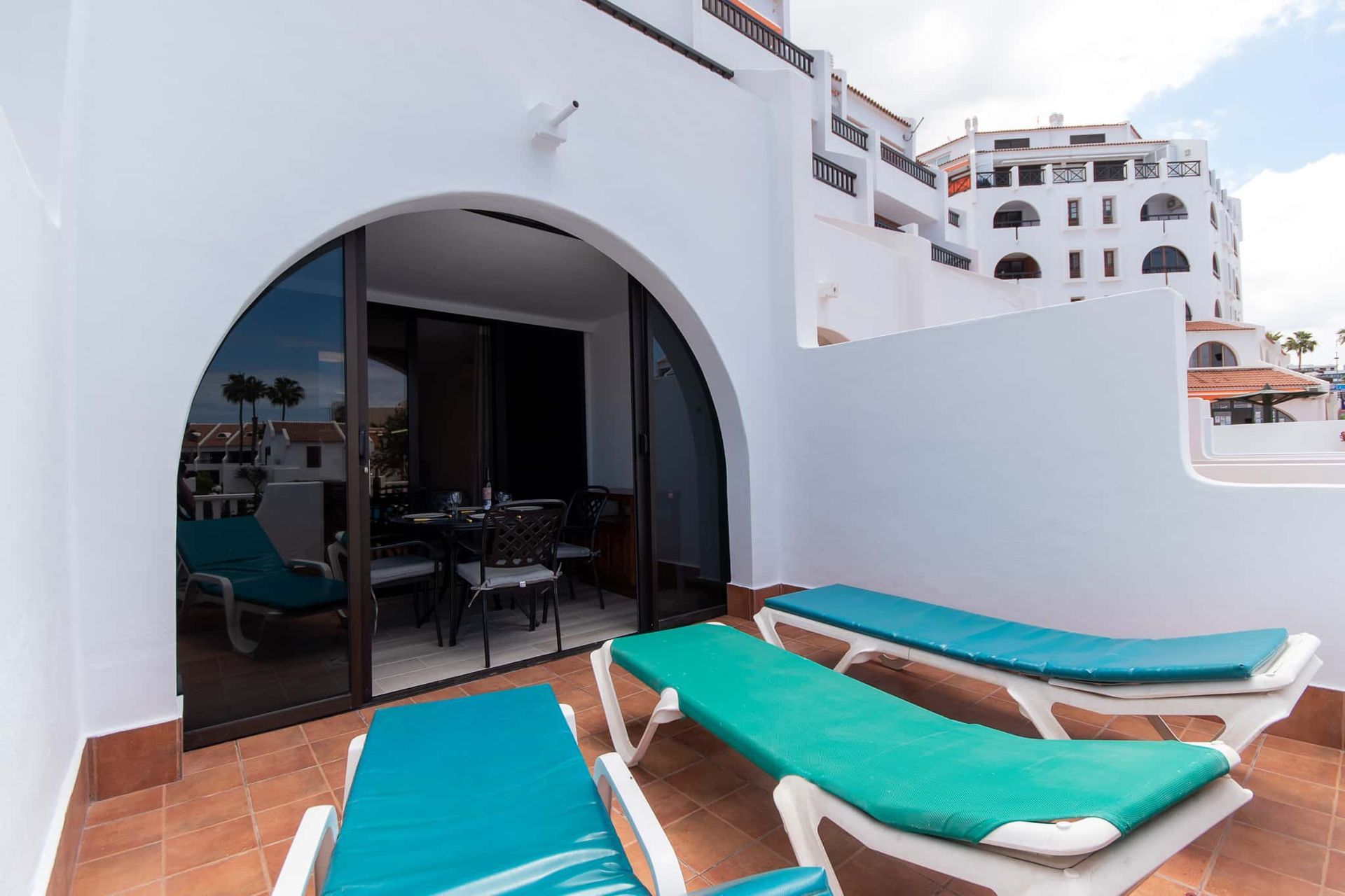 Terrace with sun loungers at Parque Santiago II, Playa de las Americas, Tenerife