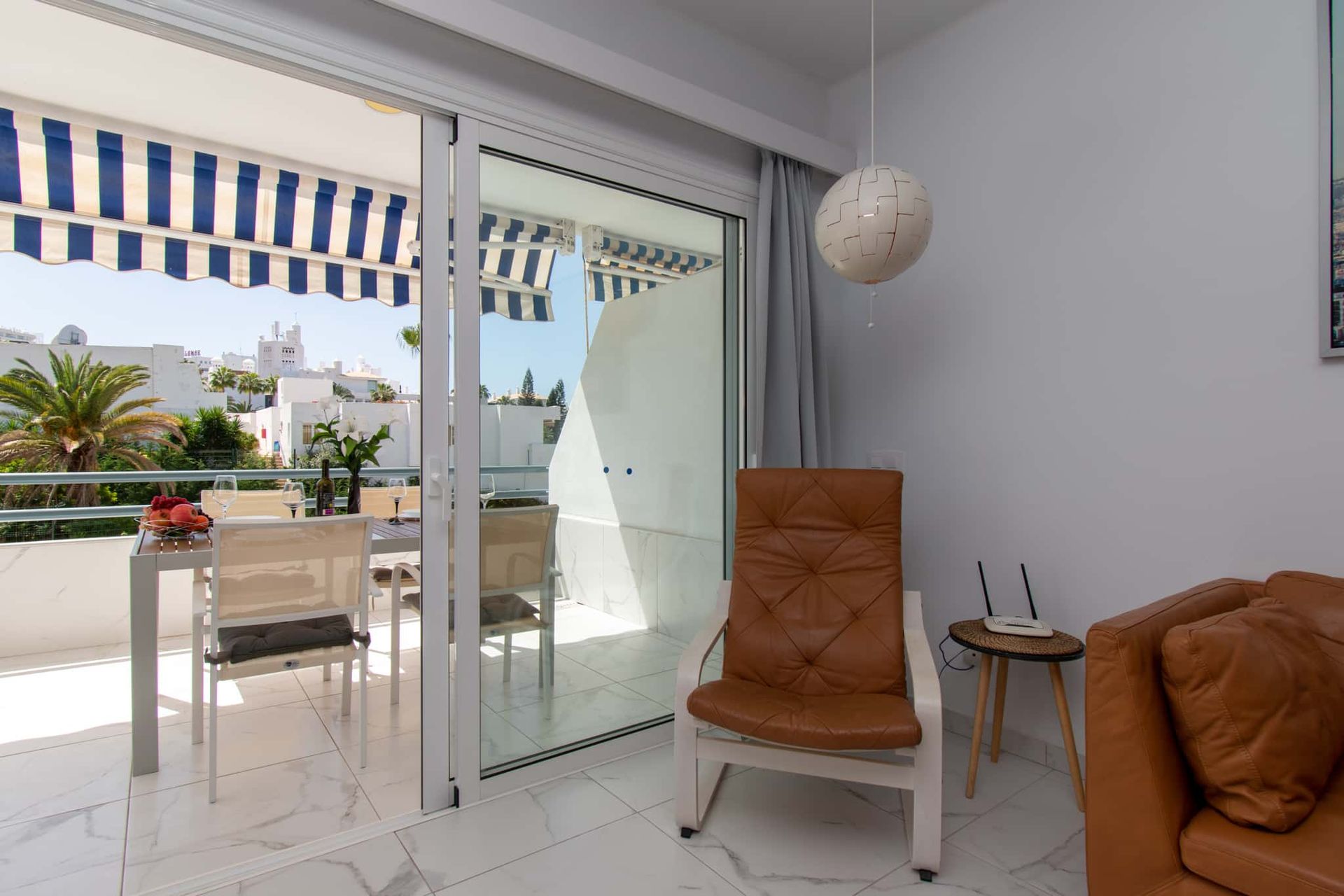 Lounge with armchair, wifi router, Club Atlantis, Costa Adeje, Tenerife.