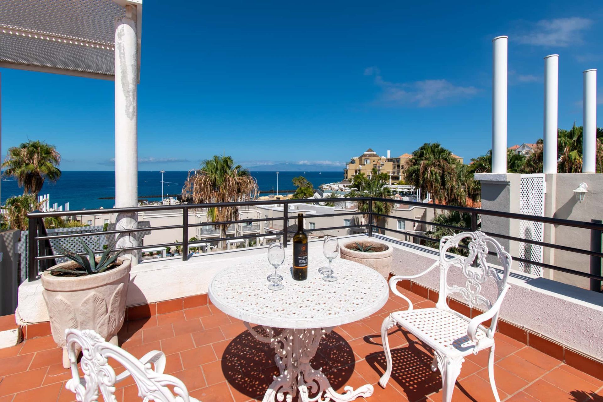 Roof terrace with patio table and chairs and sea view, Los Olivos, Costa Adeje, Tenerife.