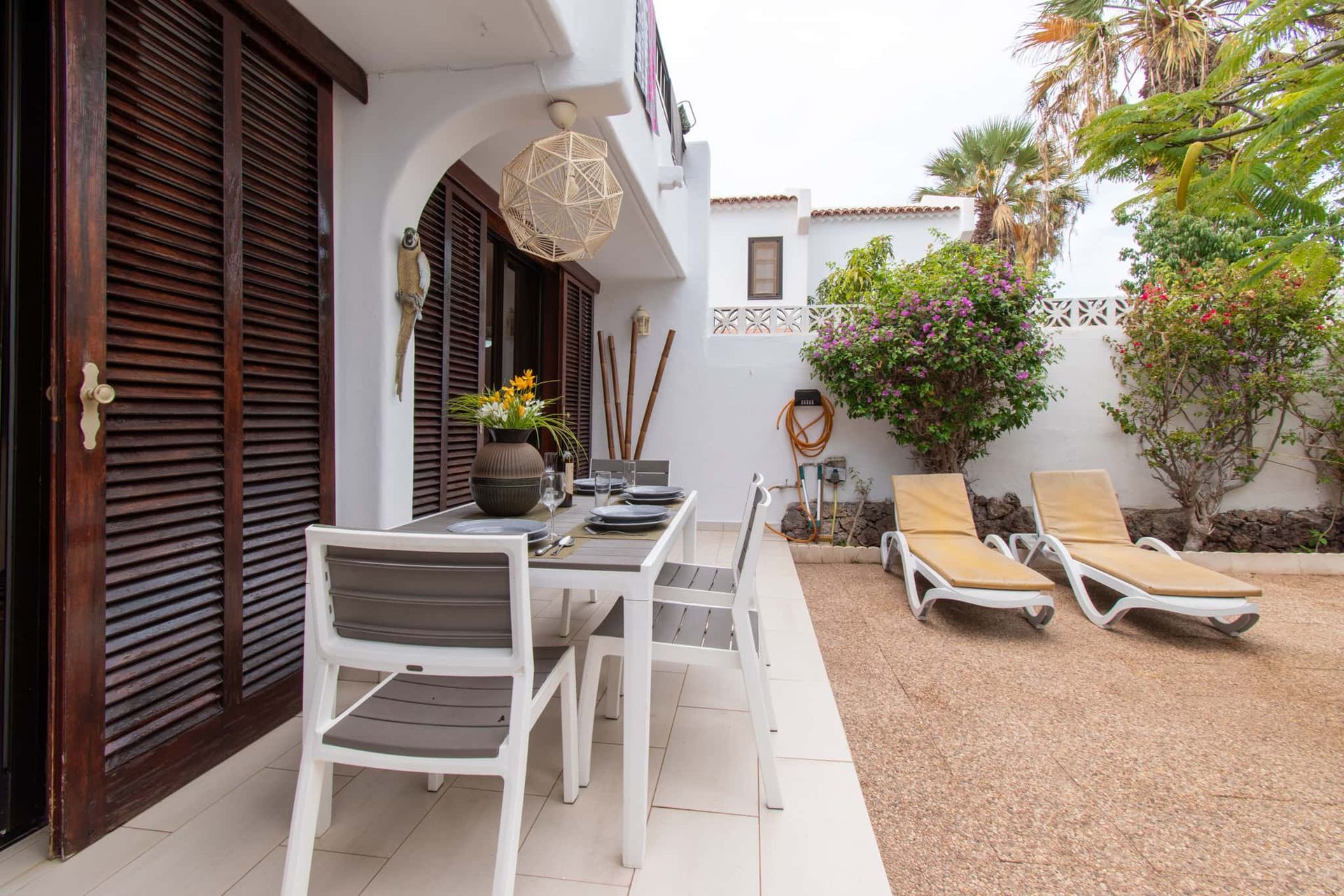 Terrace with patio table and chairs, sun loungers, Parque Santiago I, Playa de las Americas, Tenerife