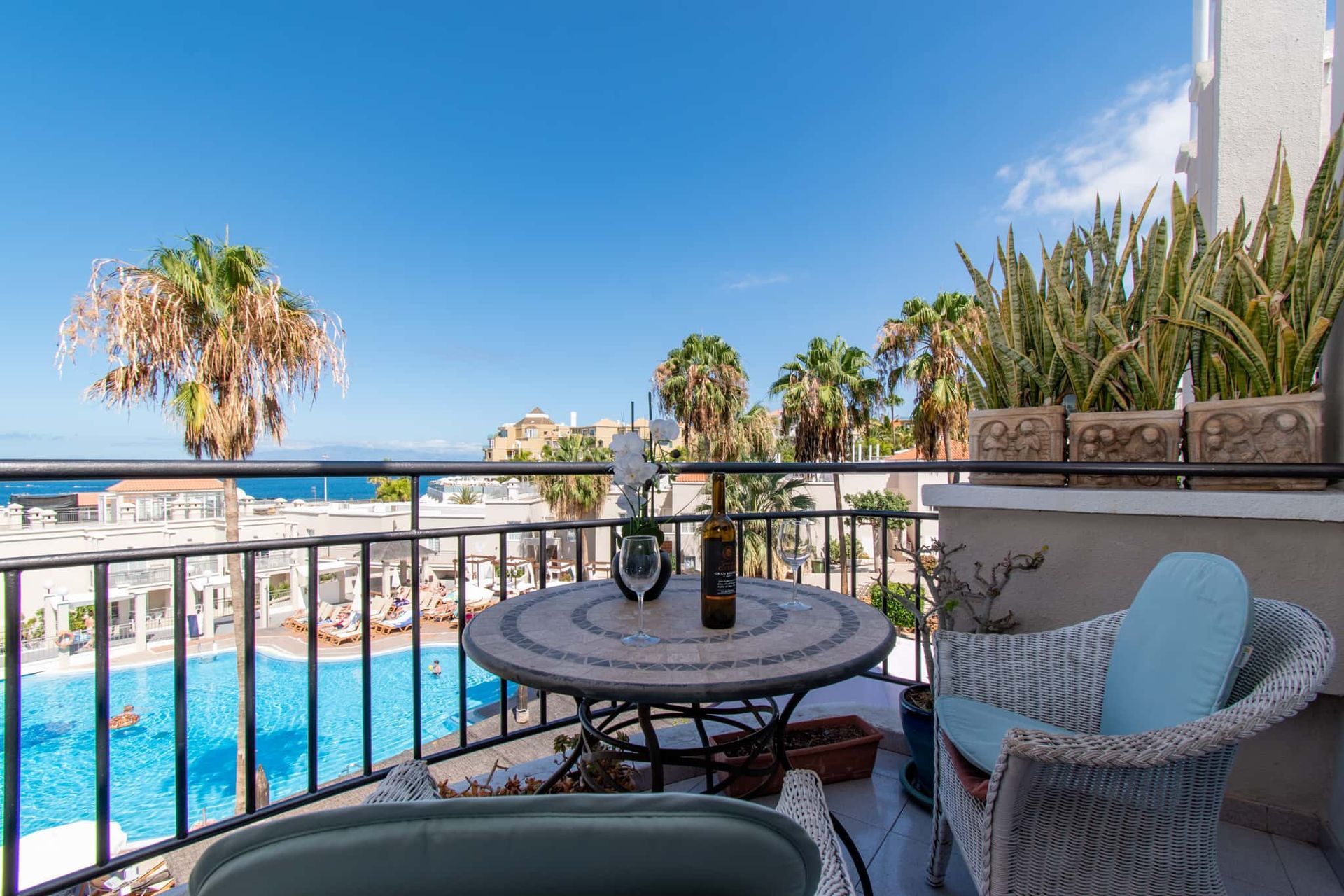 Balcony with patio table and chairs, sea and pool views, Los Olivos, Costa Adeje, Tenerife.
