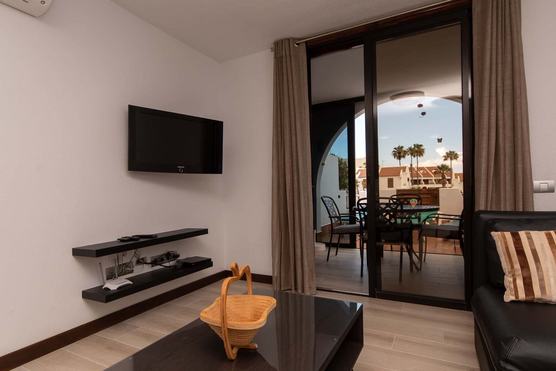 Wall mounted TV, coffee table, sofa at Parque Santiago II, Playa de las Americas, Tenerife