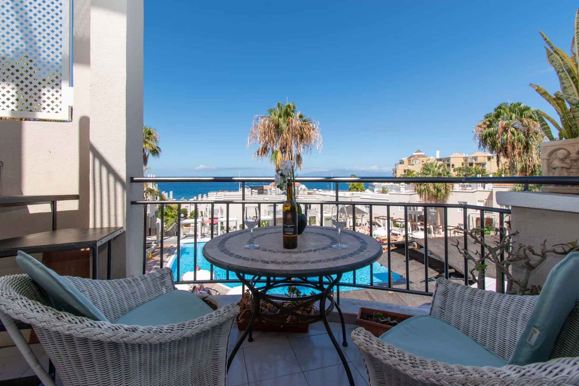Balcony with patio table and chairs, sea and pool view, Los Olivos, Costa Adeje, Tenerife.