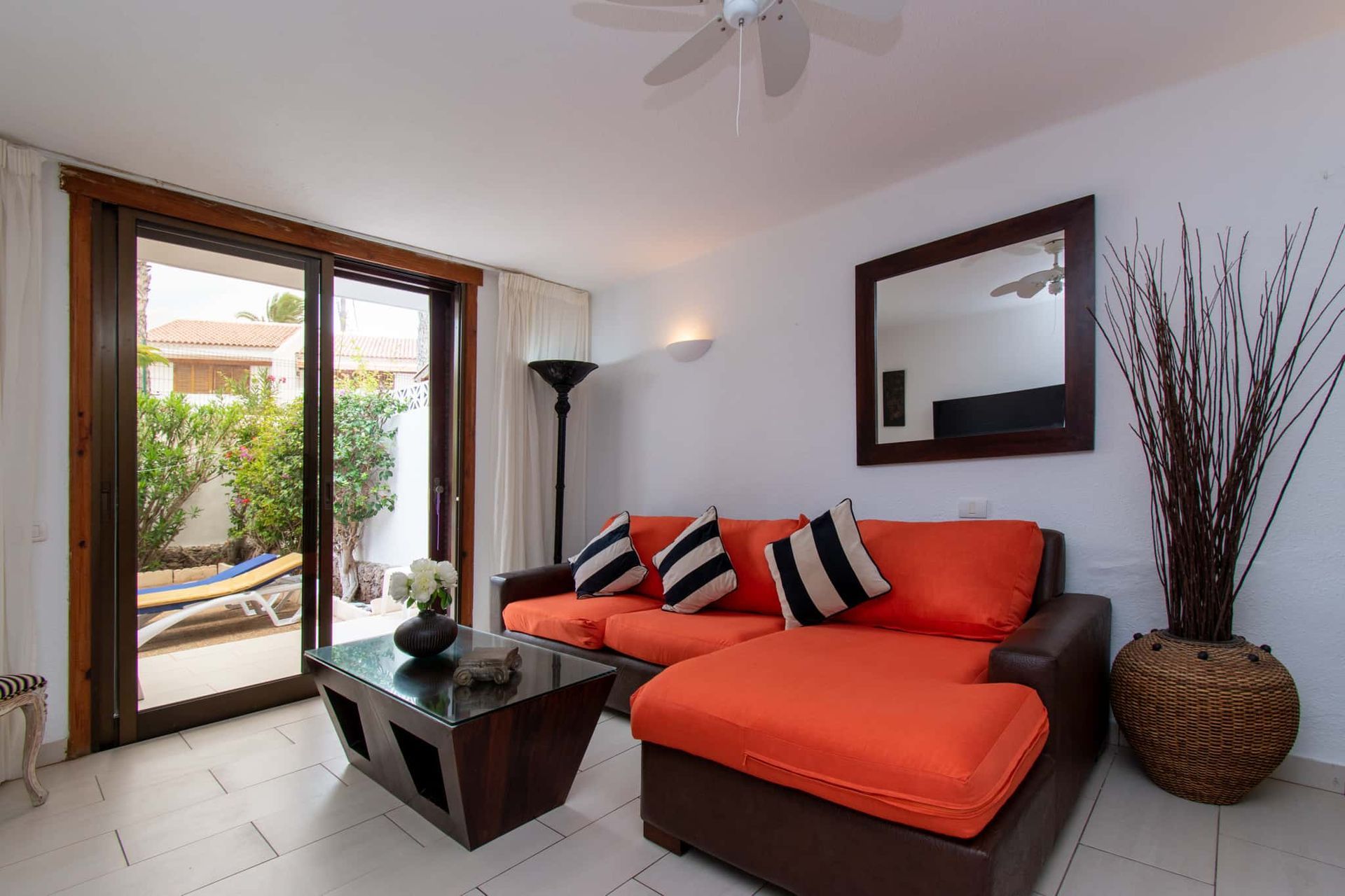 Lounge with L-shaped sofa,coffee table, mirror, lamp, Parque Santiago I, Playa de las Americas, Tenerife