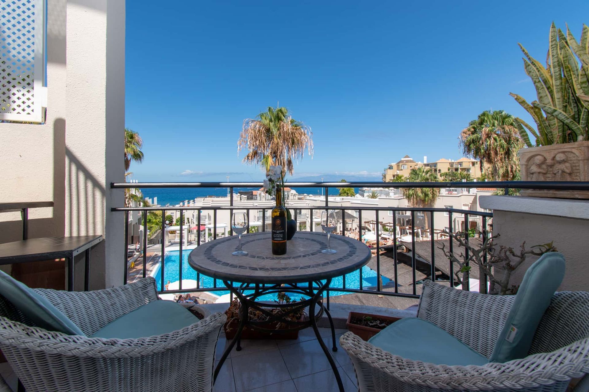 Balcony with patio table and chairs, sea and pool views, Los Olivos, Costa Adeje, Tenerife.