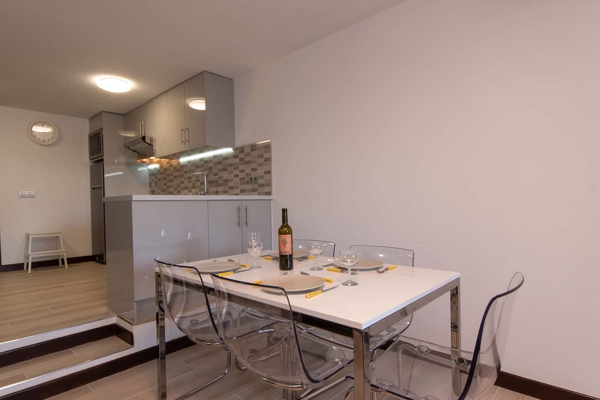 Dining table and chairs, kitchen with tall fridge freezer, microwave at Parque Santiago II, Playa de las Americas, Tenerife