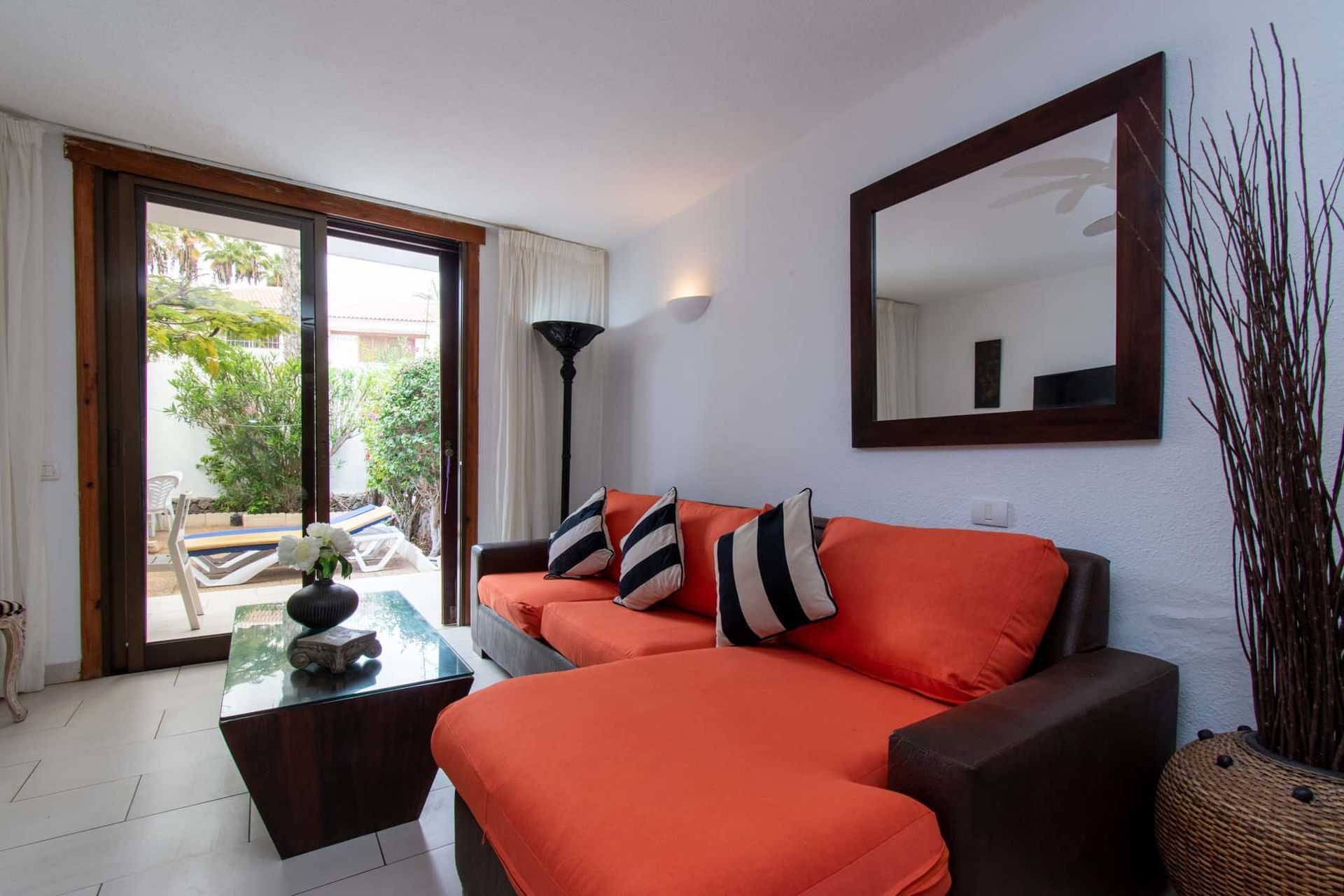 Lounge with L-shaped sofa, coffee table, mirror, lamp, Parque Santiago I, Playa de las Americas, Tenerife