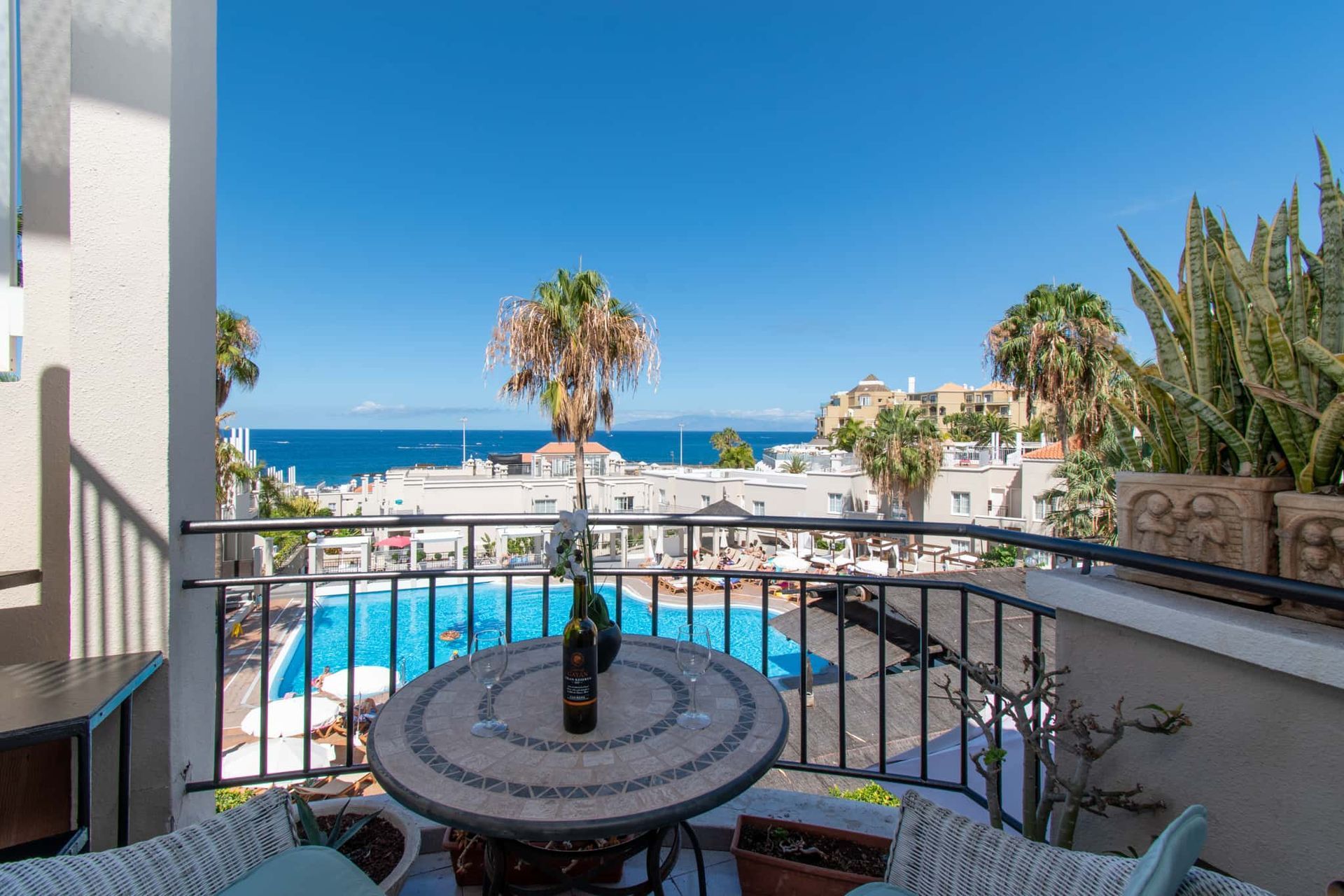 Balcony with patio table and chairs, sea and pool views, Los Olivos, Costa Adeje, Tenerife.