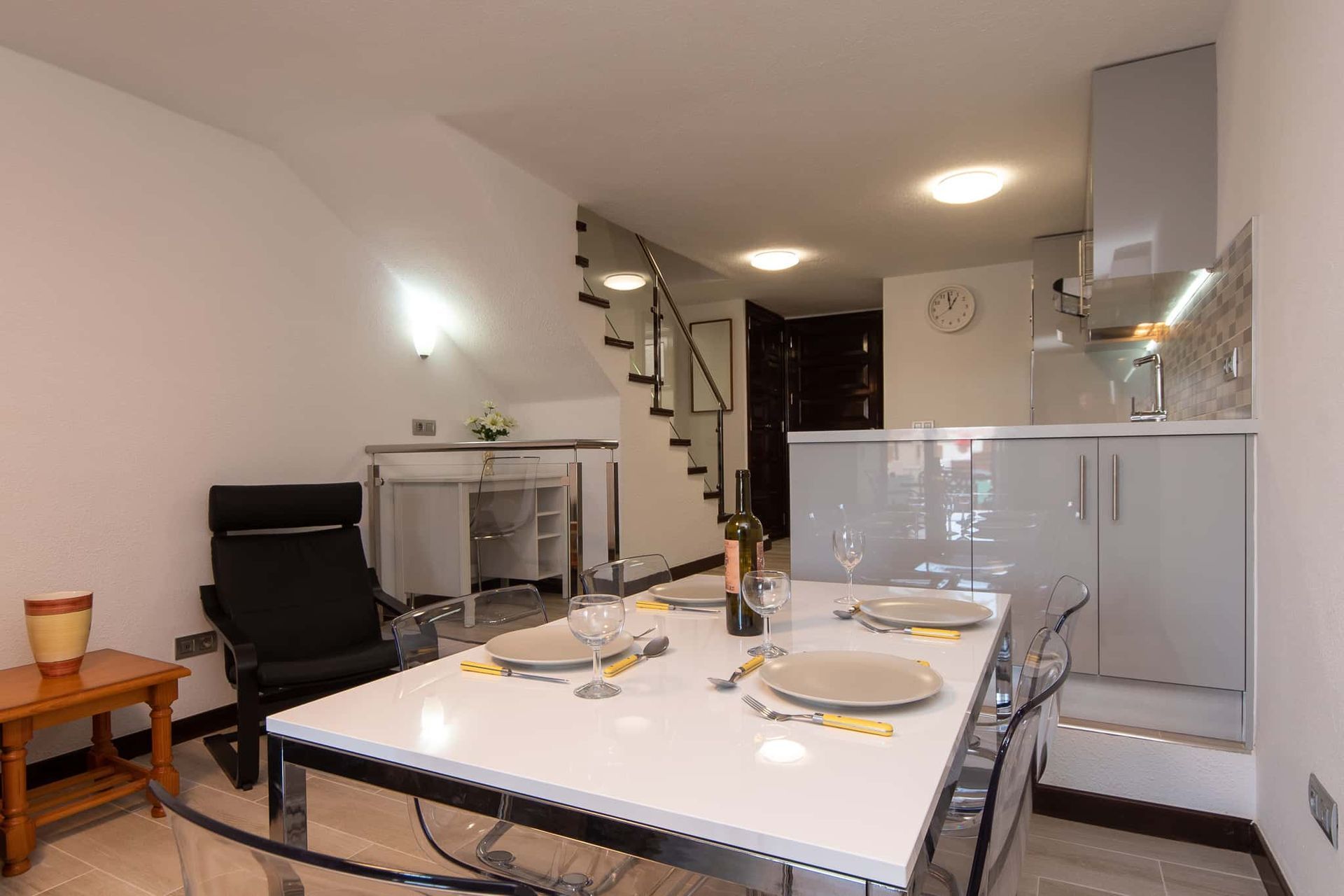 Dining table and chairs, kitchen, stairs at Parque Santiago II, Playa de las Americas, Tenerife