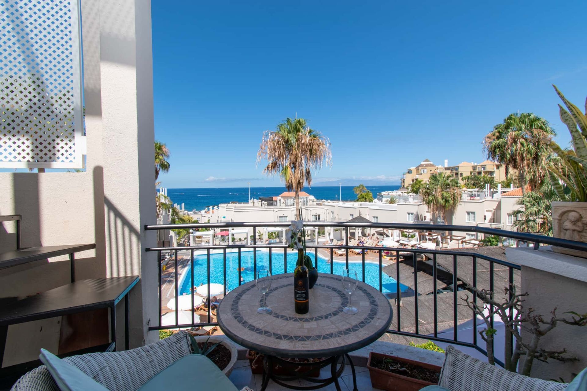 Balcony with patio table and chairs, sea and pool views, Los Olivos, Costa Adeje, Tenerife.