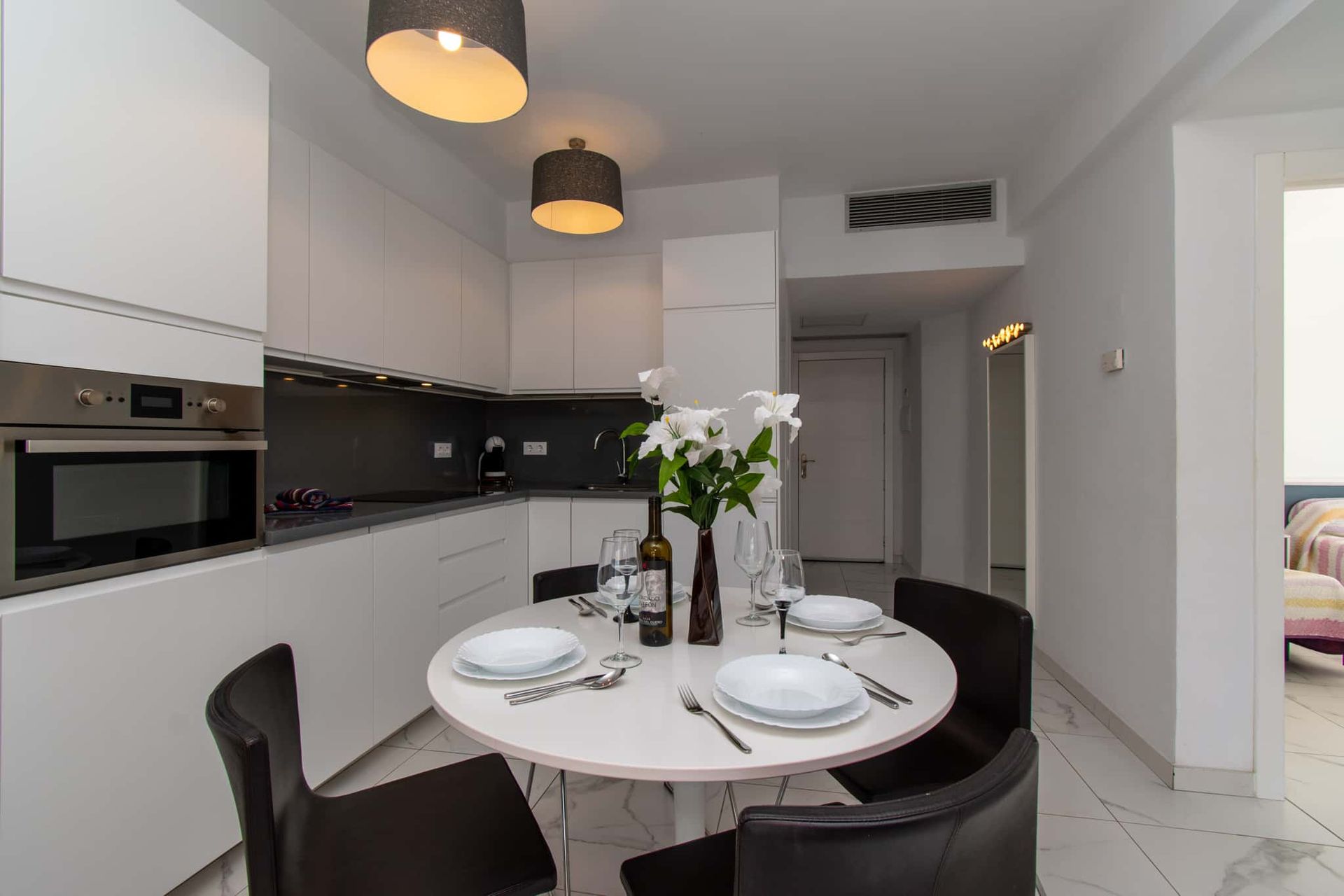 Kitchen with oven, dining table and chairs, Club Atlantis, Costa Adeje, Tenerife.
