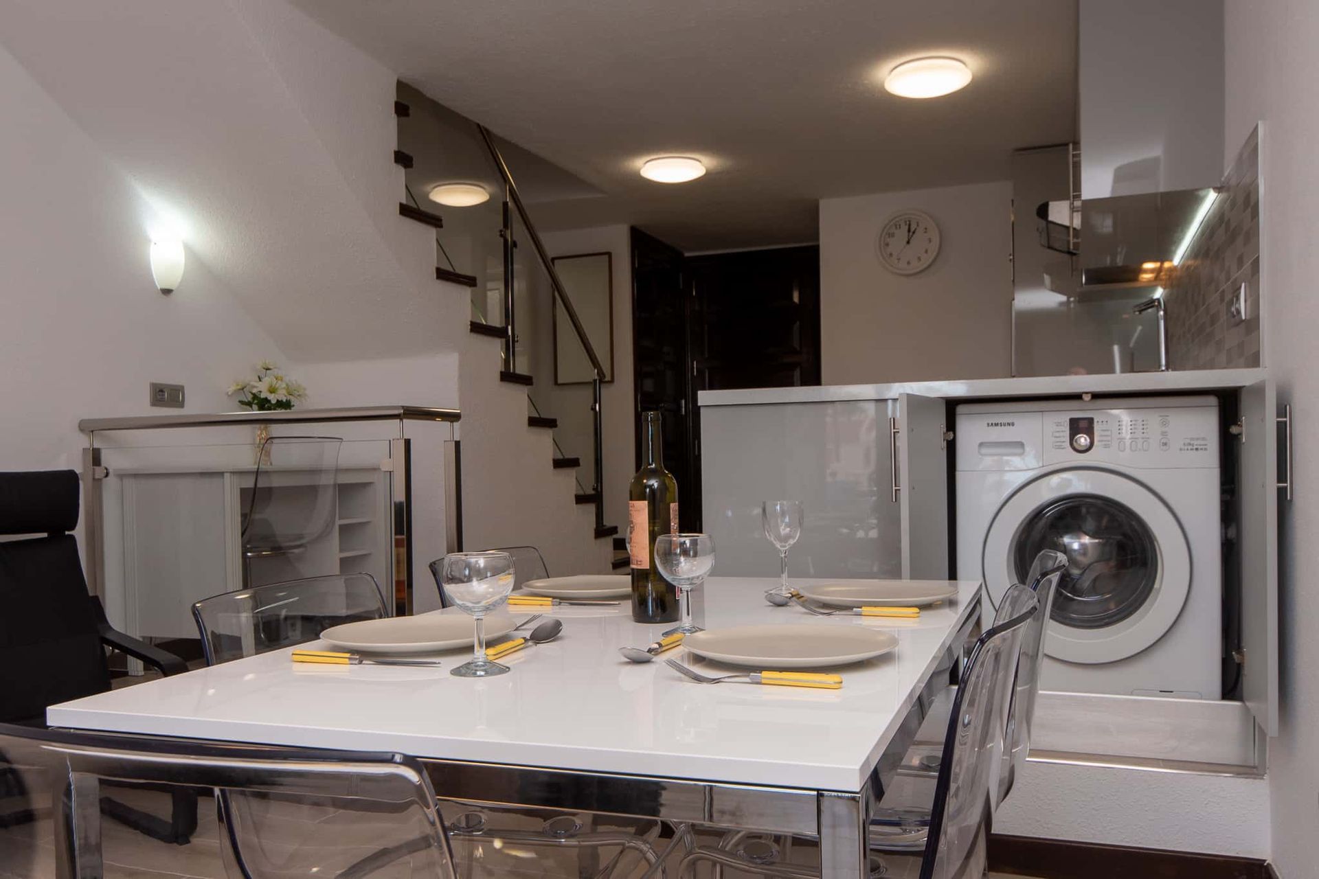 Dining table and chairs, washing machine, kitchen at Parque Santiago II, Playa de las Americas, Tenerife