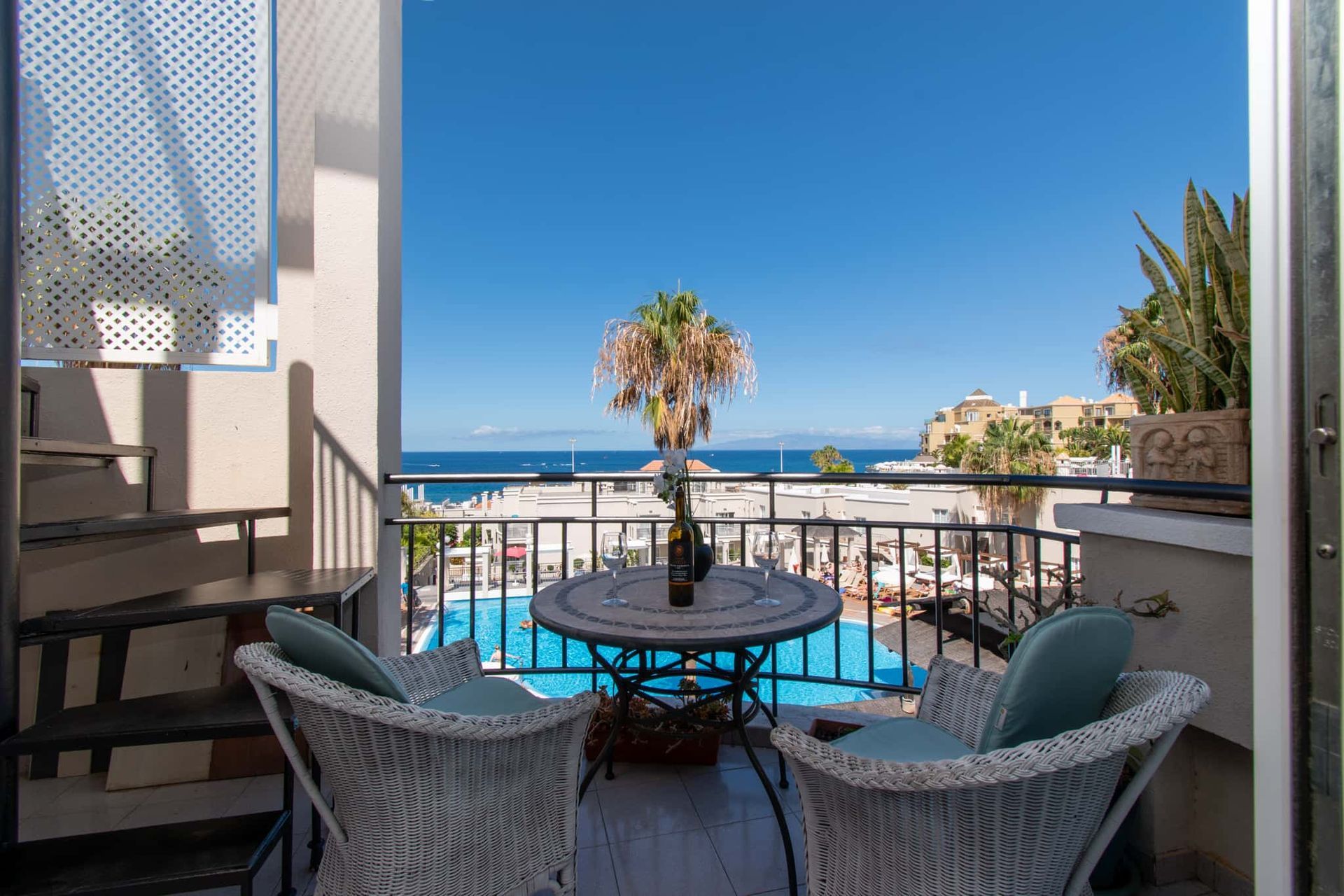 Balcony with patio table and chairs, sea and pool views, Los Olivos, Costa Adeje, Tenerife.