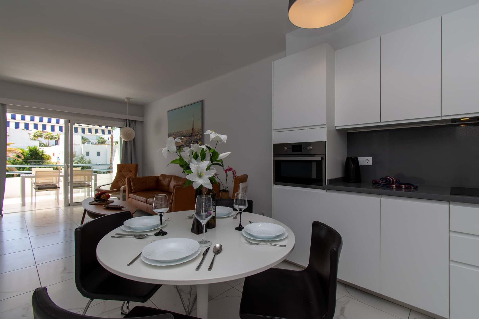Kitchen with oven, dining table and chairs, Club Atlantis, Costa Adeje, Tenerife.