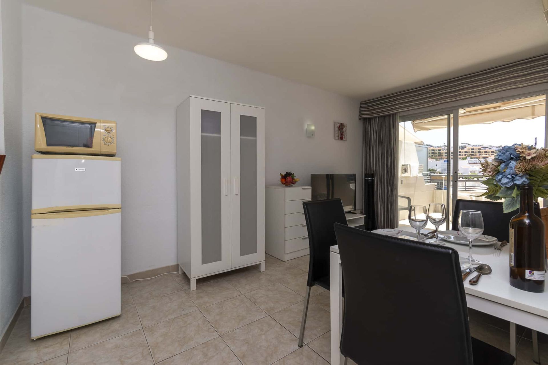 Dining table and chairs, tall fridge/freezer, microwave, Santa Maria, Costa Adeje, Tenerife