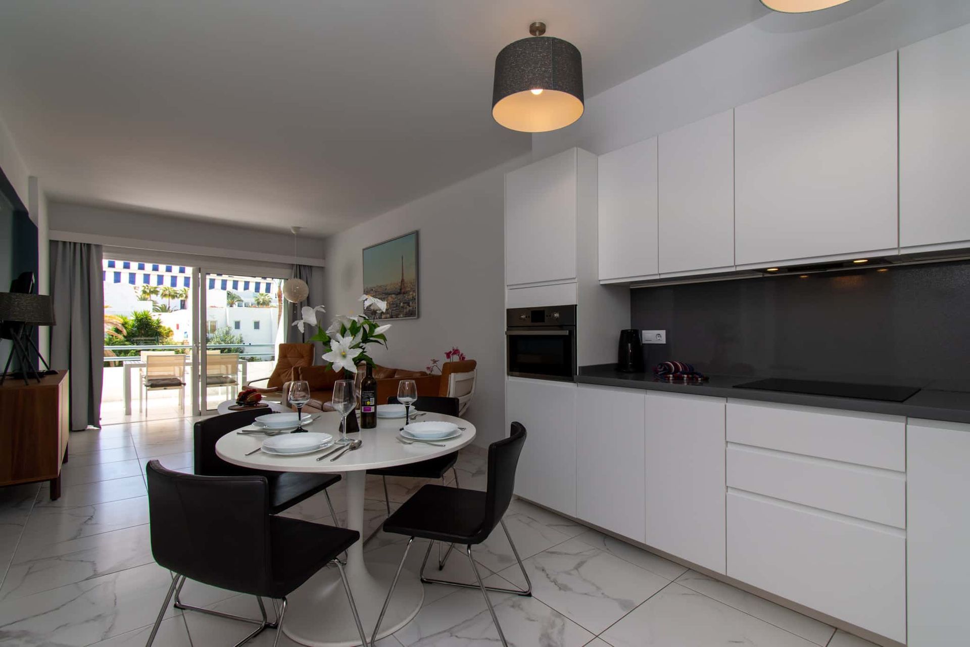Kitchen with dining table and chairs, oven, Club Atlantis, Costa Adeje, Tenerife.