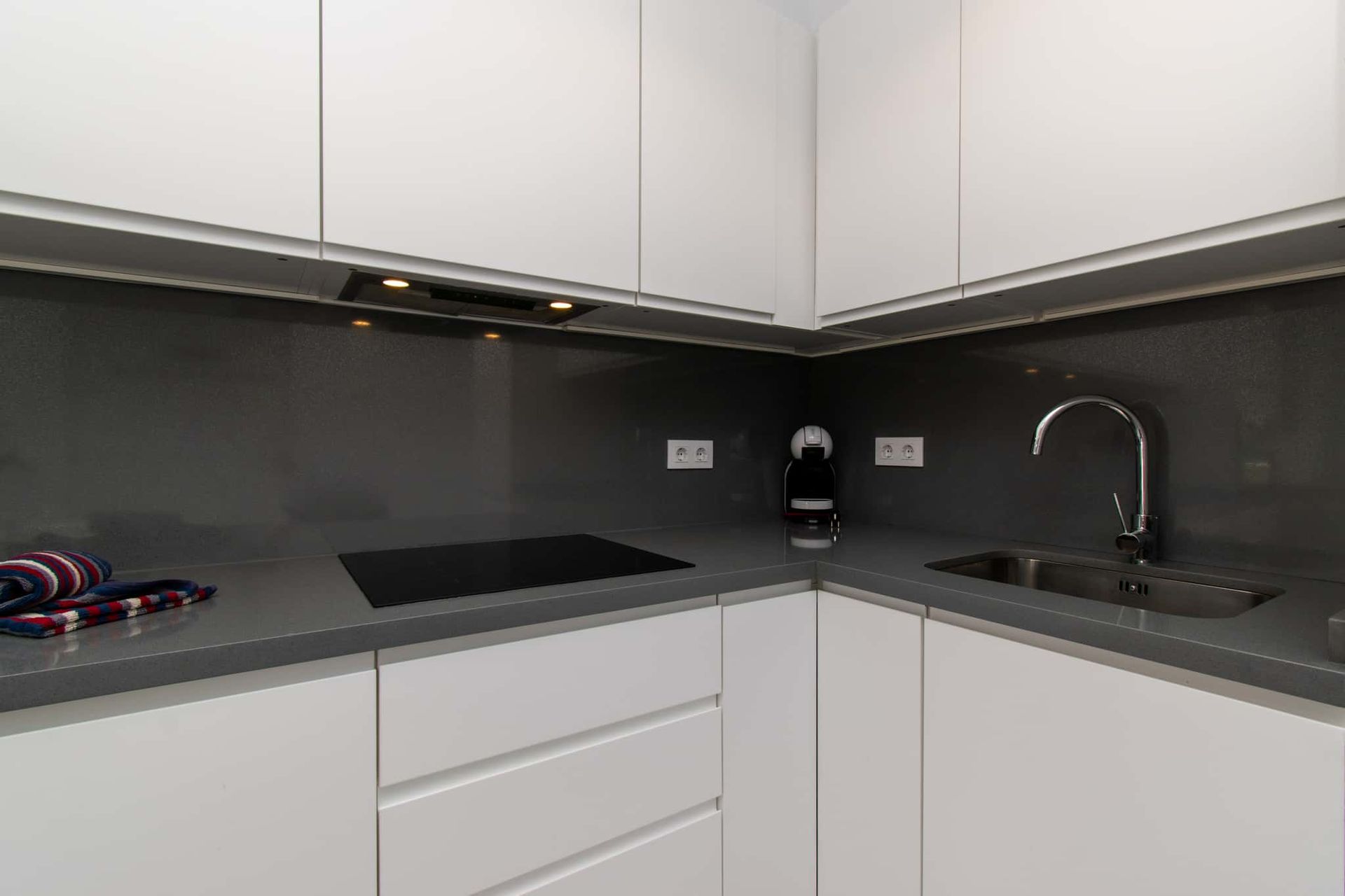 Kitchen with hob, extractor fan, coffee maker, sink, Club Atlantis, Costa Adeje, Tenerife.