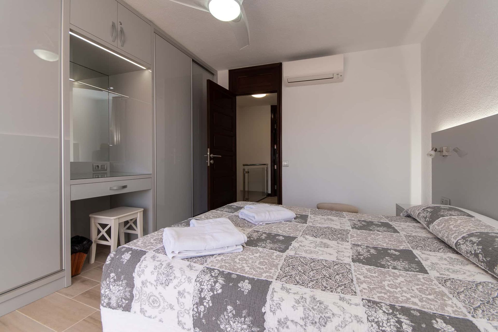 Bedroom with double bed dressing table and stool, air conditioning at Parque Santiago II, Playa de las Americas, Tenerife