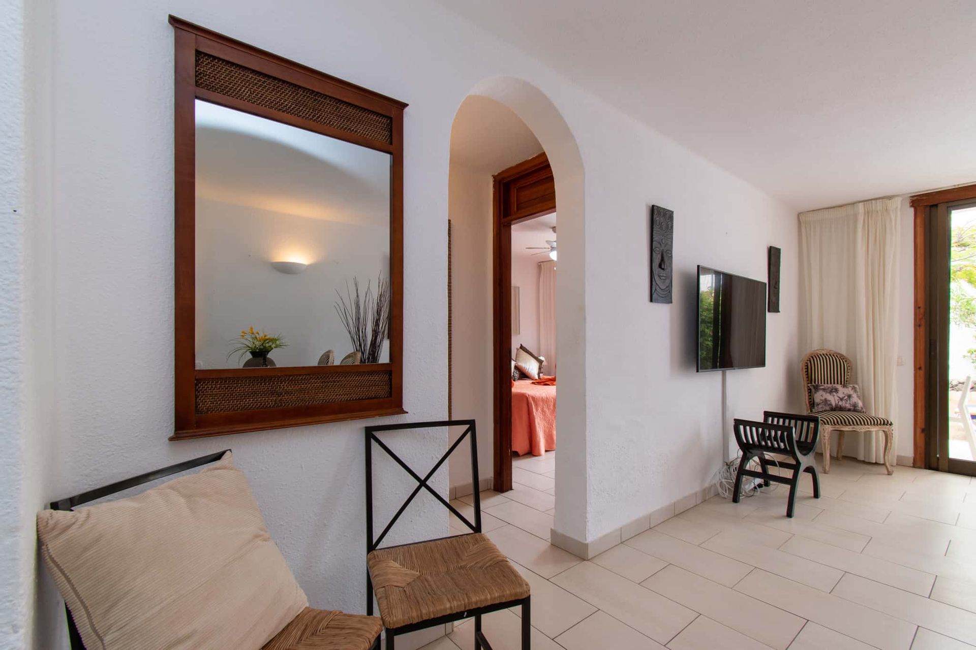 Lounge, wall-mounted TV, occasional chairs, mirror, Parque Santiago I, Playa de las Americas, Tenerife