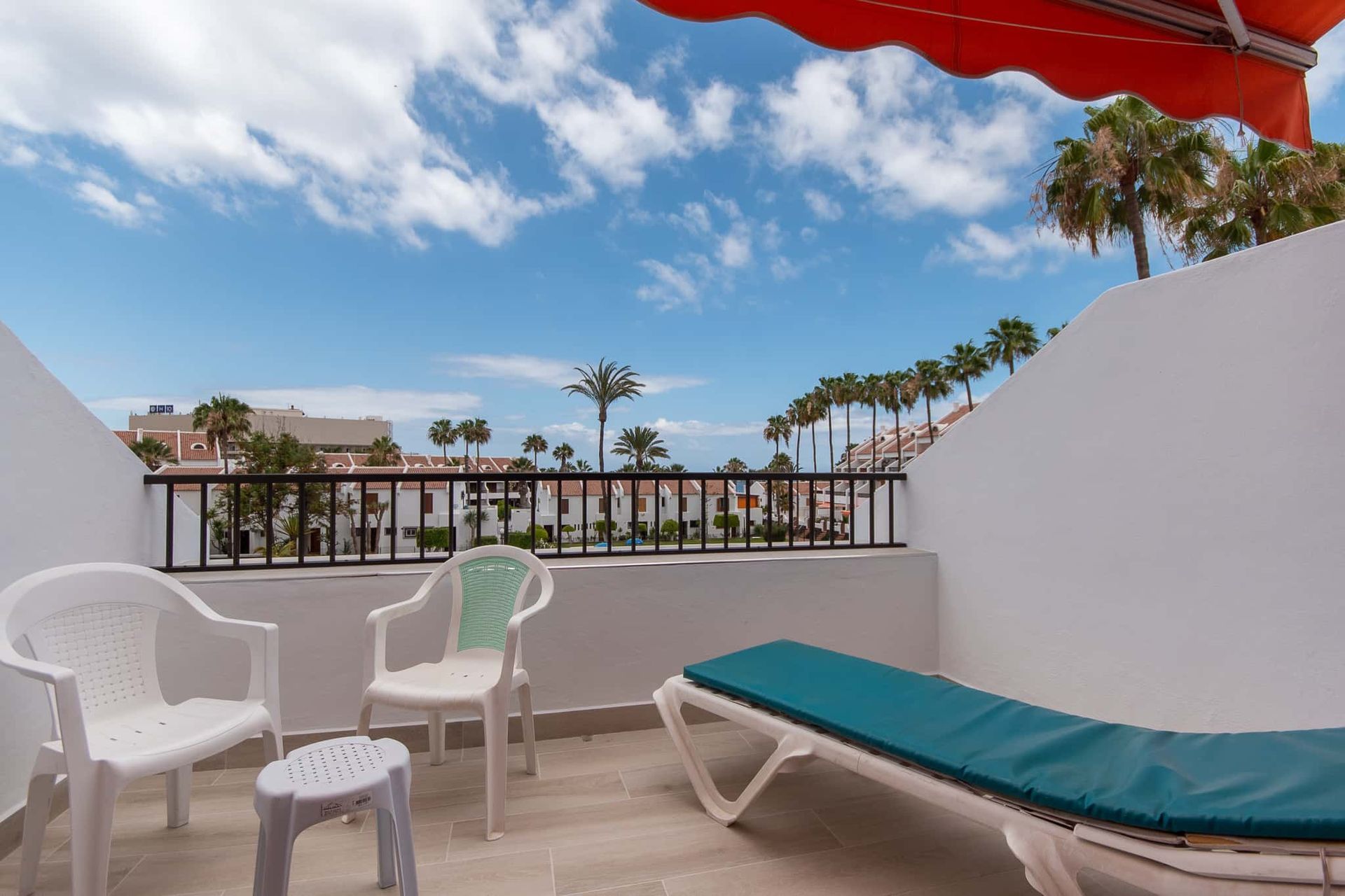 Balcony with sun lounger, chairs with small table at Parque Santiago II, Playa de las Americas, Tenerife
