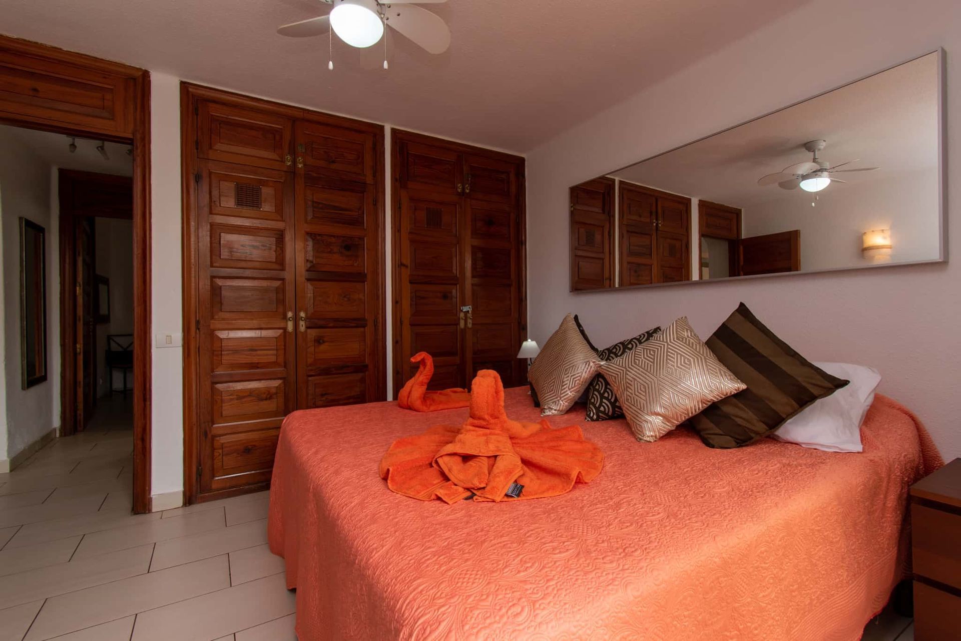 Bedroom with double bed, large mirror, ceiling fan, wardrobes, Parque Santiago I, Playa de las Americas, Tenerife