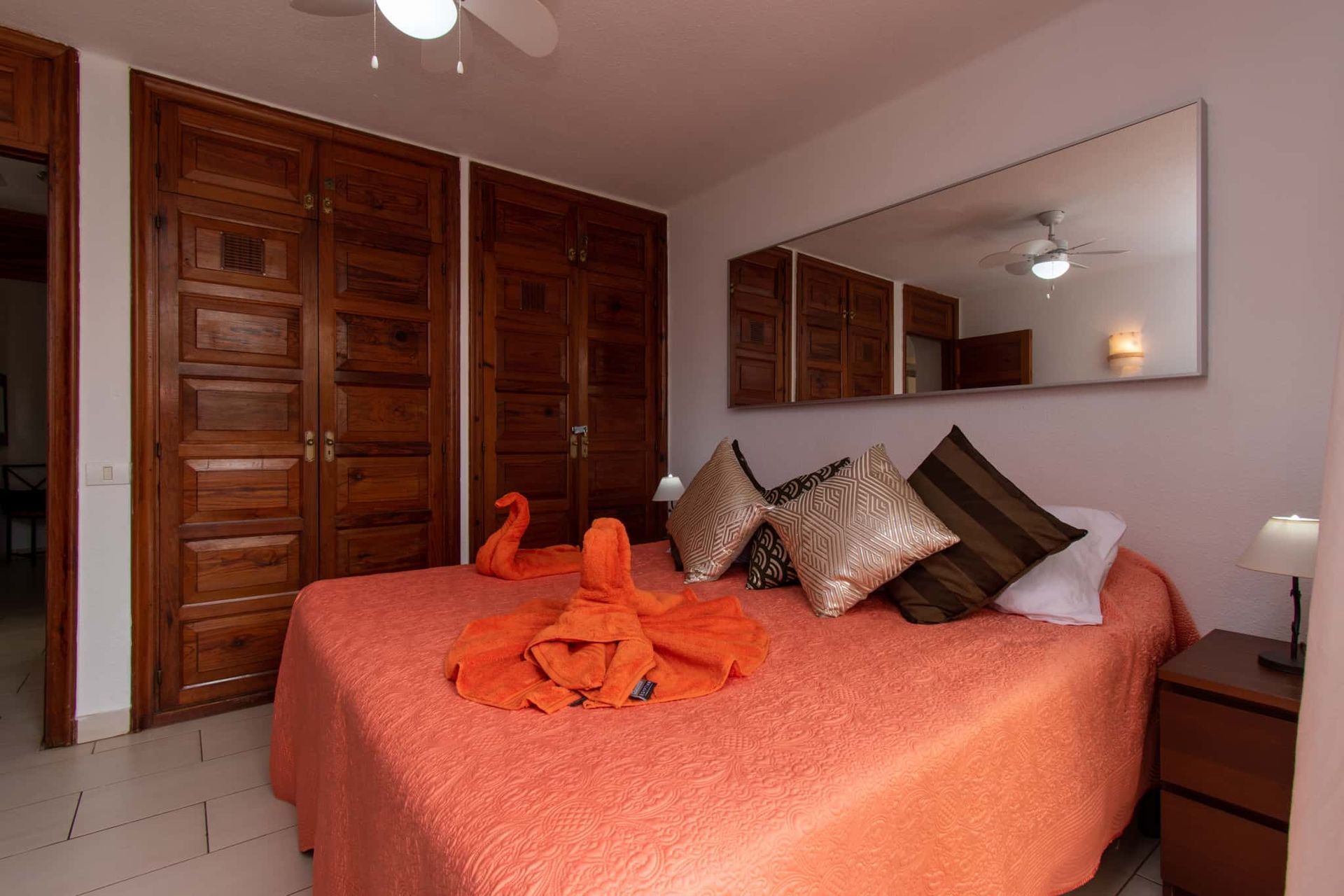 Bedroom with double bed, large mirror, ceiling fan, wardrobes, Parque Santiago I, Playa de las Americas, Tenerife