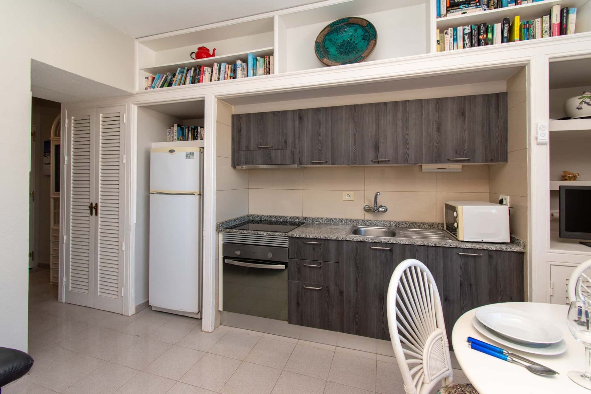 Kitchen with tall fridge/freezer, oven, hob, sink, microwave,Los Olivos, Costa Adeje, Tenerife.