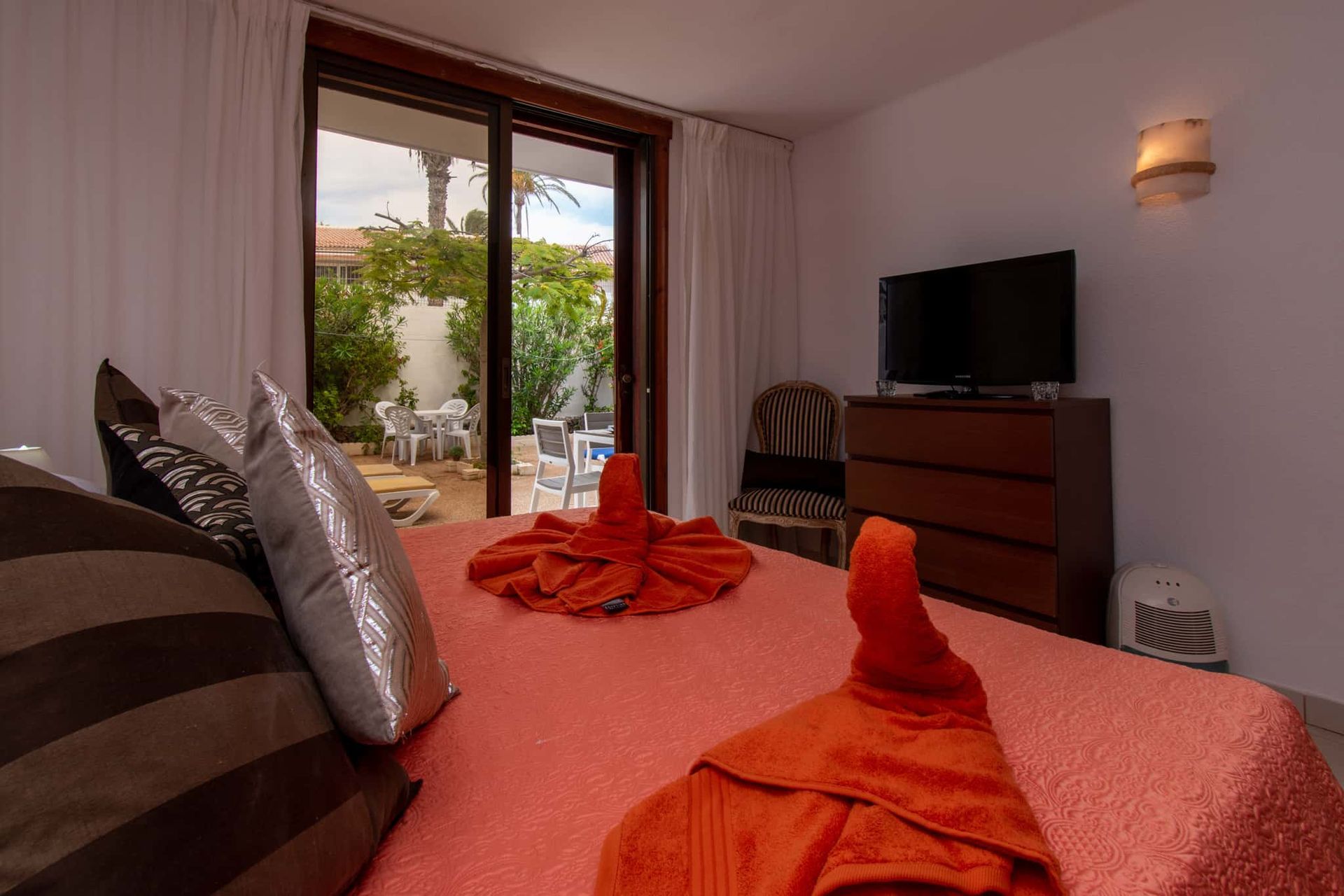 Bedroom with double bed, chest of drawers, TV, patio doors leading to terrace, Parque Santiago I, Playa de las Americas, Tenerife